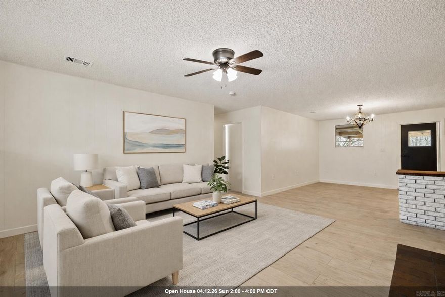 FULLY UPDATED HOME ON ACREAGE IN WEST LITTLE ROCK!! This home features 3 bedrooms and 2 fully updated bathrooms with custom tile showers, PLUS an office or bonus room. Fresh paint and LVP flooring run throughout the home. The open kitchen offers granite countertops, stainless steel appliances, and a spacious breakfast area. The living room features a wood-burning fireplace with a brick hearth and abundant natural light. Step outside to a huge covered back porch overlooking the flat backyard with mature trees and a chicken coop. If you enjoy watching deer but want the convenience of being just minutes from the highway, this one is for you.