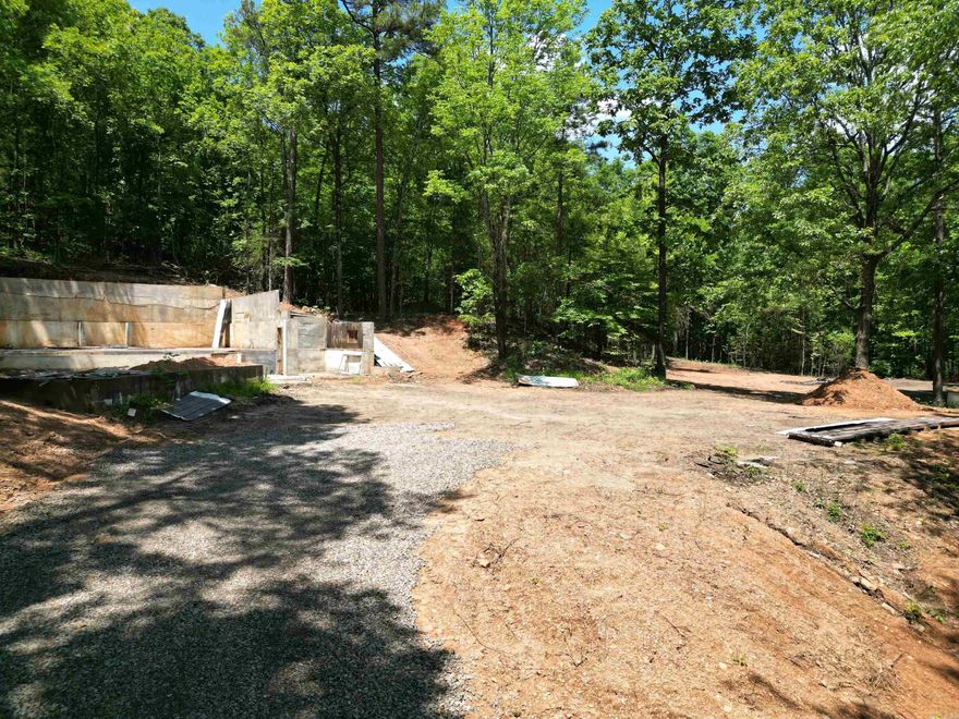 Beautiful country setting with endless possibilities! This surveyed and perc-tested property offers a concrete foundation where a previous home once stood, plus a flat, cleared area ready to build on. Surrounded by a mix of woods and open space with abundant wildlife. Water and electric available at the street. No restrictions—bring your plans and make it yours! Motivated seller says bring an offer! Well on site w/ visible water about 30ft down!