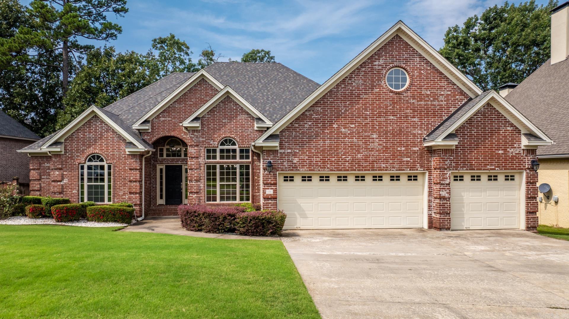 Charming 4BR/3.5BA in the family-favorite Villages of Wellington in Chenal. Step into a tall-ceiling foyer with hardwoods leading to a tray-ceiling living room with dual-sided gas fireplace and built-ins. The kitchen features a new granite breakfast bar, new built-in gas stove, and a window-wrapped breakfast area with fireplace. Formal dining with columns, private half bath, and vaulted office with oversized storage are just off the entry. The main-level primary suite offers box ceiling, walk-in shower, jetted tub, dual vanities, and large closet. Upstairs includes a Jack & Jill suite with new walk-in shower, spacious closets, plus a bonus room with wet bar, storage bench, full bath, and walk-in closet. Enjoy a covered patio overlooking a flat, shaded, fenced backyard. Extras include laundry with washer/dryer that can stay, and oversized 3-car garage with new motor.