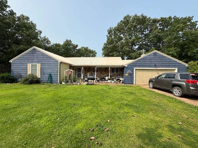 3 Bed, 3 Bath Home on 1.2 Acres with Upgrades Discover your home on West Tri Lakes Dr. in Horseshoe Bend AR. This 3-bedroom, 3-bathroom residence sits on a generous 1.2 +/- acre lot, offering both space and tranquility. Step inside to find a large kitchen area boasting an abundance of cabinet storage, perfect for any home chef. A separate dining room provides a space for entertaining. Cozy up by one of two fireplaces, both featuring efficient wood inserts. This home offers ample storage throughout, including a large laundry room for added convenience. The full walk-out basement provides incredible versatility, with upgraded electrical, and brand-new tile floors. An extra wooded lot adds to the property's privacy. Enjoy the views of White Oak Lake (when there's water), creating a picturesque backdrop. Green thumbs will appreciate the two dedicated garden areas and established fruit trees. Recent upgrades include a newer HVAC system and a convenient hook-up for a generator. The exterior boasts a durable new metal roof. This property offers an unbeatable combination of comfortable living and a great location!