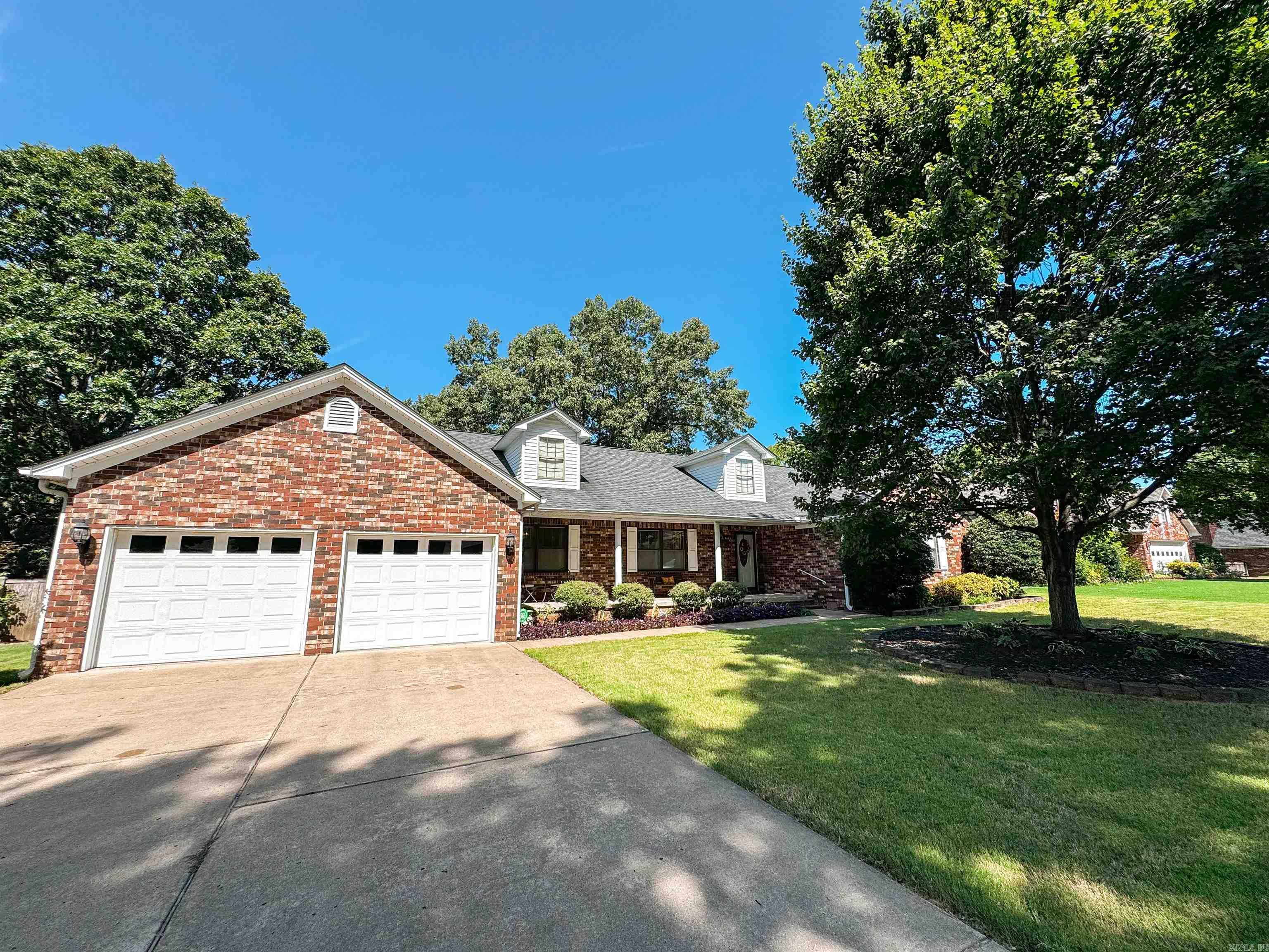 Welcome to this spacious home nestled in River Oaks Subdivision located in Searcy near a golf course, retail, restaurants & hospital. This home boasts an amazing view off the back covered porch as it is elevated above the homes behind it. This thoughtful layout has two spacious living areas as well as a formal dining room AND a roomy breakfast area. The kitchen has updated appliances, luxury vinyl floors, pantry and is near the large laundry room that has another pantry, storage & a half bath. The fenced backyard has a great storage building & there is also another storage closet in the garage big enough for tools, gardening equipment or more closets! The living room, den & hallways have a great quality laminate flooring. Each bedroom has a walk-in closet and speaking of closets, there are an abundance in this home! Roof was new in 2017 & new HVAC installed in 2023. Other features include Pella windows, quartz countertops in kitchen & baths, new carpet in 2021, leaf filters on gutters in 2022 & more. AGENTS SEE REMARKS for other updates.