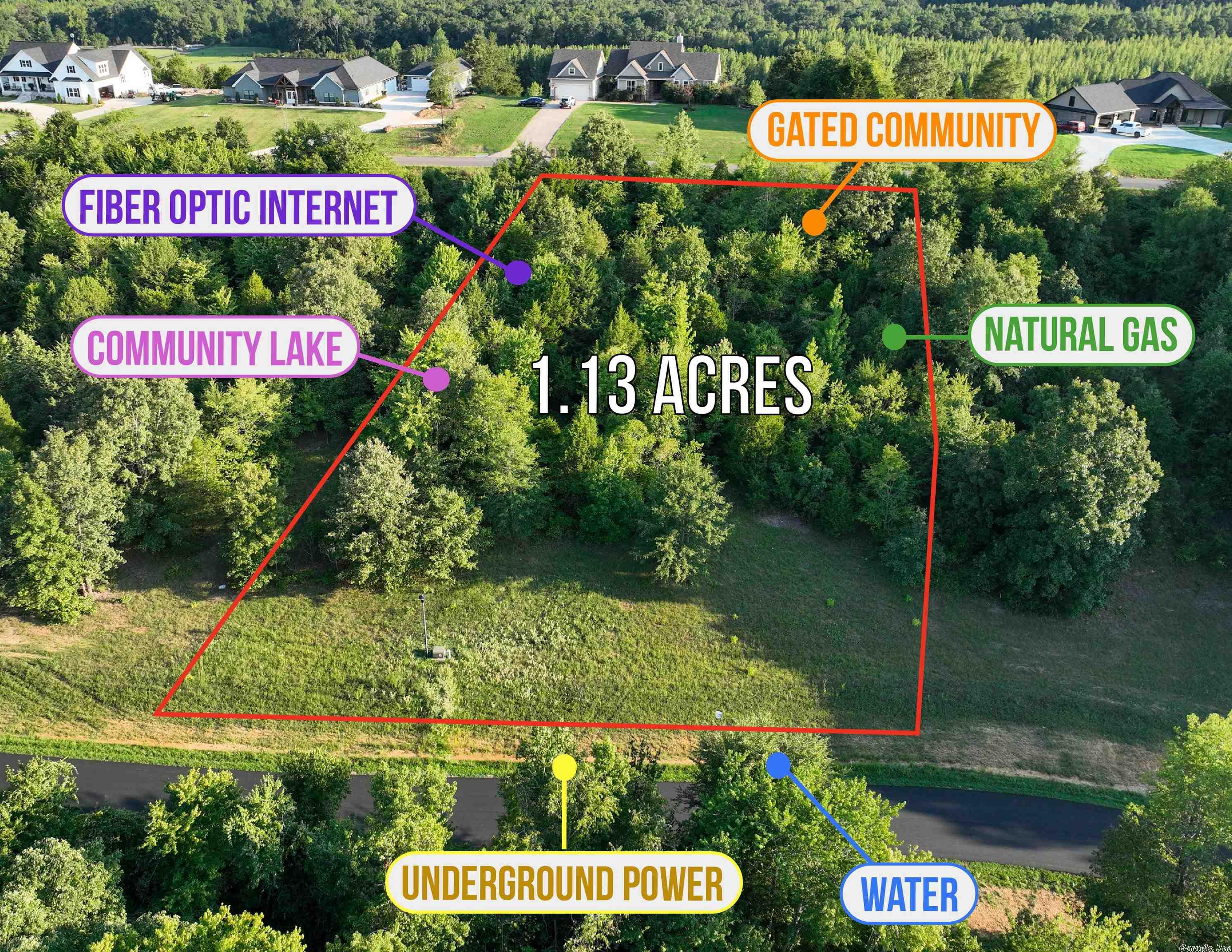 Gated wooded community with two entrances, underground power, water, natural gas and fiber optic internet. Community lake. Restricted to site built homes, 1850+ sq ft, no mandatory builder nor time to build.