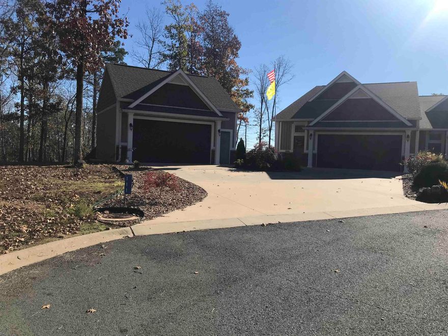 PANORAMIC LAKE VIEW OF GREERS FERRY LAKE from this luxury townhome.  Breathtaking views are enjoyed from living/dining area, Master BR, patio & loft.  Top quality building materials & finishes from floor to high-sloping ceiling!  Wood & tile flooring, soft colors, granite counters, energy efficient features.  The main level has 2BR, 2Ba, living/dining/kitchen, laundry, & pantry, access to the 2-car garage, all handicap accessible.  The Master suite has dual closets, bath with shower & double vanity.  The huge loft is a BR with sitting area, plus a large bathroom.  An additional detached garage is spacious enough for additional vehicles, boat, ATV, and other toys, plus lots of storage.  The acreage is landscaped & groomed, with an iron fence for side & back yard.  Relax on the back patio to the sweeping view, & watch the wildlife.  Guess what???  It's furnished for quick possession and luxurious living!!  You'll be a member of all Fairfield Bay Resort amenities to have an active lifestyle right out your front door.    Golf, swimming pools & parks, minigolf, tennis and pickleball, marina, bowling alley, restaurants, ATV trails, hiking trails.  You'll be the envy of your friends! AR