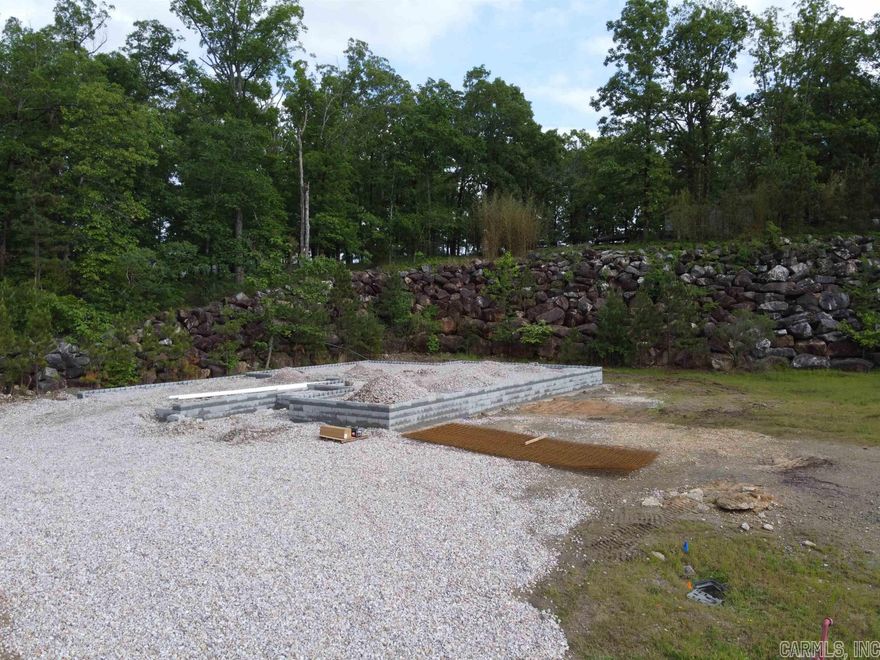 Located in the heart of Hot Springs in the highly coveted Forest Lakes Sub, this NEW CONSTRUCTION features experienced custom craftsmanship both inside and out. This open concept 3 bedroom, 2 bath house has 1,655 sq ft on ONE LEVEL with custom cabinets in kitchen and bathrooms, solid surface countertops, luxury vinyl plank flooring throughout, sprinkler system, architectural roof, electric fireplace, covered back patio, primary bedroom featuring soaker tub with separate shower, 2 car garage and much more.