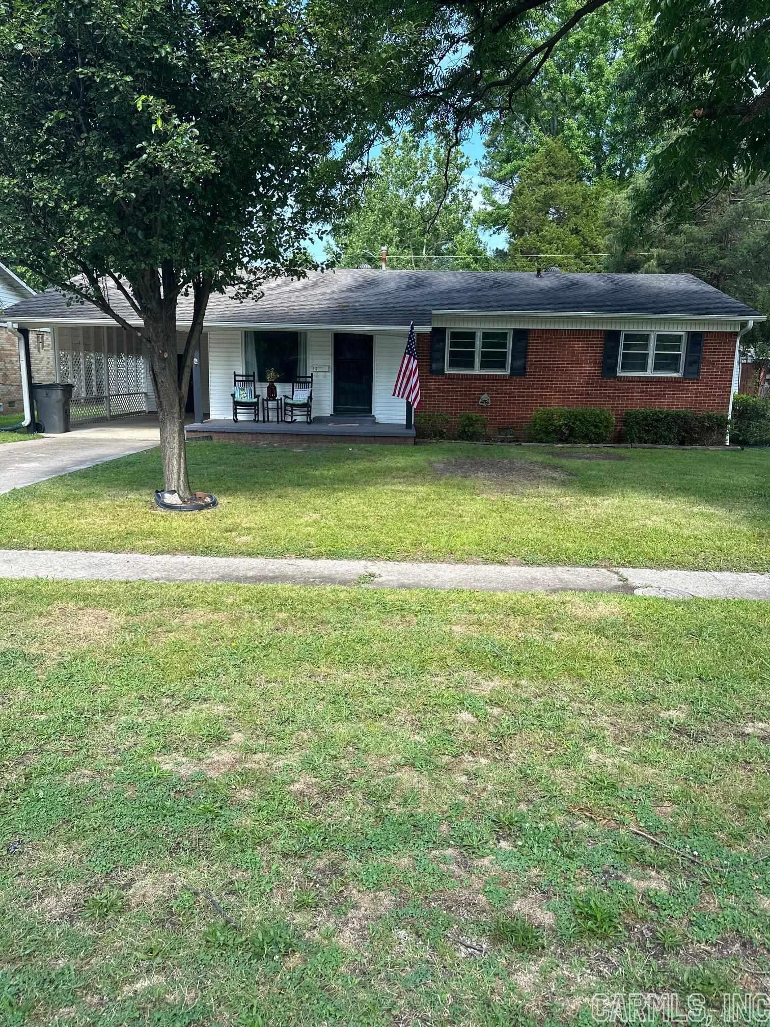 This Charming 3 bed, 1 bath brick home is perfect for anyone looking for a cozy and comfortable place to call home. The home features original wood floors, primary central heat and air, and backup gas heat. It is situated on a corner lot with a nice front porch and covered car port. The newer roof and straight lines of the house makes it a great investment. Plus, its located in a good area, making it a must-see.