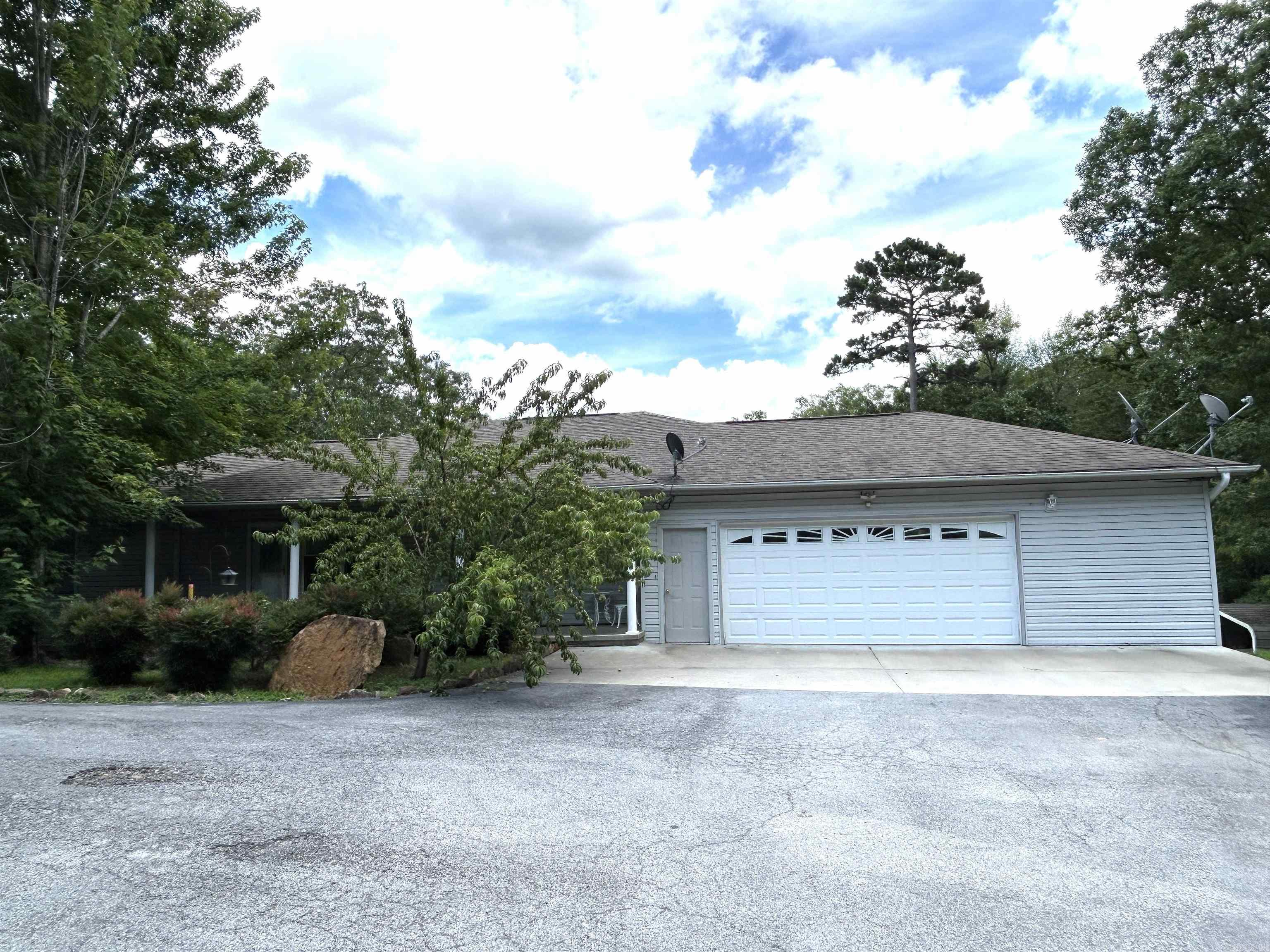 Impeccably maintained house and large shop located at the end of a quiet road. The large open floor plan features a spacious kitchen with vaulted ceilings and a kitchen skylight that fills the room with natural light. The generously sized rooms come with large closets for lots of storage, This property includes a 2-car garage, a bonus storage room, a bonus kitchen downstairs, a safe room, a utility/mud room complete with a full bathroom, a bunk room providing extra room for guests and family members, walk out top deck, and a lower level walk-out patio for outdoor entertaining. Call today for your private showing!