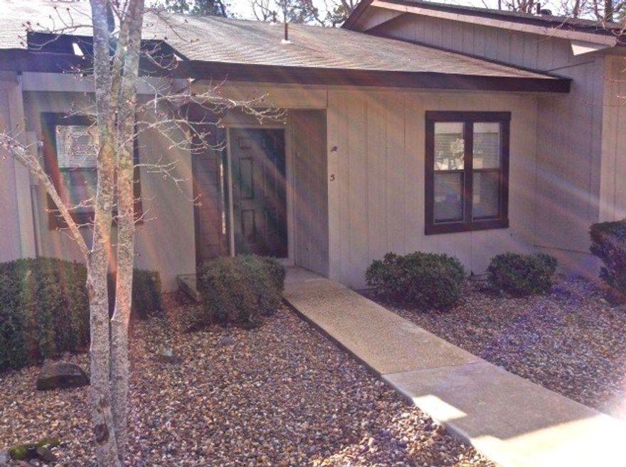 Enjoy the spacious kitchen of this well utilized floor plan! With extra cabinetry and an eat-in kitchen area, you'll feel right at home! Separate dining area and living room access to the deck overlooking the woods! Nicely updated and ready to move right in! Some furniture can convey! Conveniently located near all west gate shopping, medical, golf, lake, pools, etc, this 2 bedroom, bath and a half will meet the needs of your permanent residence or vacation get away! Seller offering one year home warranty!