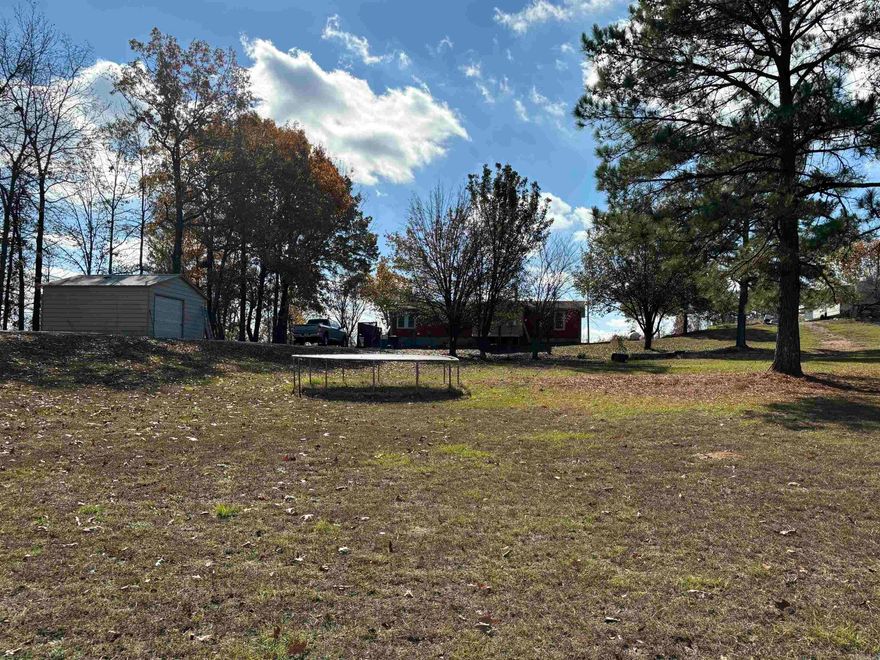 Plenty of room to spread out on this 2.76 acres!  There's 4 bedrooms /2 baths and a screened in sunporch for your growing family. Also included is a spacious deck to entertain on next summer! For all your projects there's a newer 20x20 shop with concrete floors and electricity or a smaller shed for storage. There's tankless hot water and the home sits on a permanent foundation.