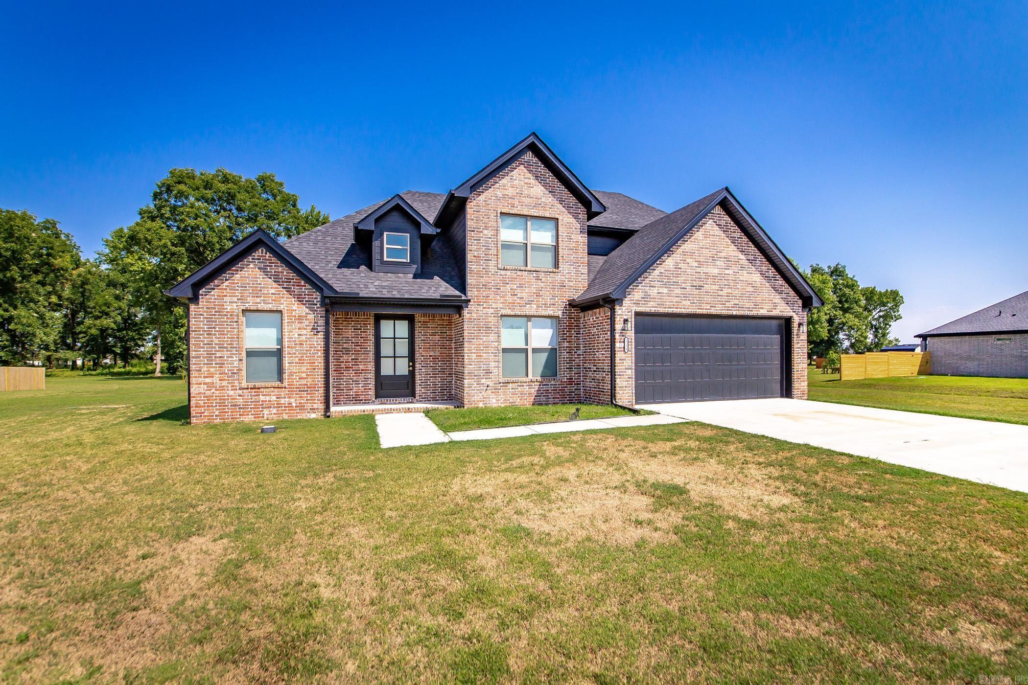 Stunning home in the fabulous Ashley Downs Subdivision. Welcome home to this beautiful property built in 2023. Nestled on a spacious 1.25 acre lot, this meticulously designed home offers modern living at its finest. This residence features three generous bedrooms and 2.5 baths. The main level boasts a luxurious primary bedroom, providing ultimate convenience & privacy, while two additional bedrooms are located upstairs. Step inside to discover an inviting gas fireplace. The well appointed eat-in kitchen is a chef's dream, featuring a gas stove, walk-in pantry and ample counter space for meal prep. Enjoy year-round comfort with a mini-split system upstairs, and electric blinds throughout. Luxury vinyl flooring and plush carpet flow seamlessly throughout, combining style with practicality. Step outside to relax on the covered patio, ideal for outdoor entertaining or enjoy quiet moments in nature. The expansive yard offers plenty of room for activities, gardening, or simply soaking up the sun. Don't miss your chance to own this exceptional home in a vibrant community. Schedule your viewing today! See agent remarks