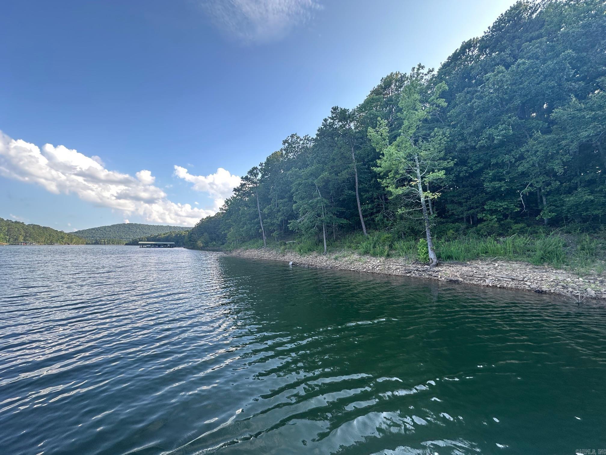 LAKEFRONT LOT WITH EASY WALK TO THE WATER This beautiful tree covered lot i ready for your new build. Located in the beautiful Cobalt Bay Subdivision, This lot has Electricity, Water and Fiber to the lot.