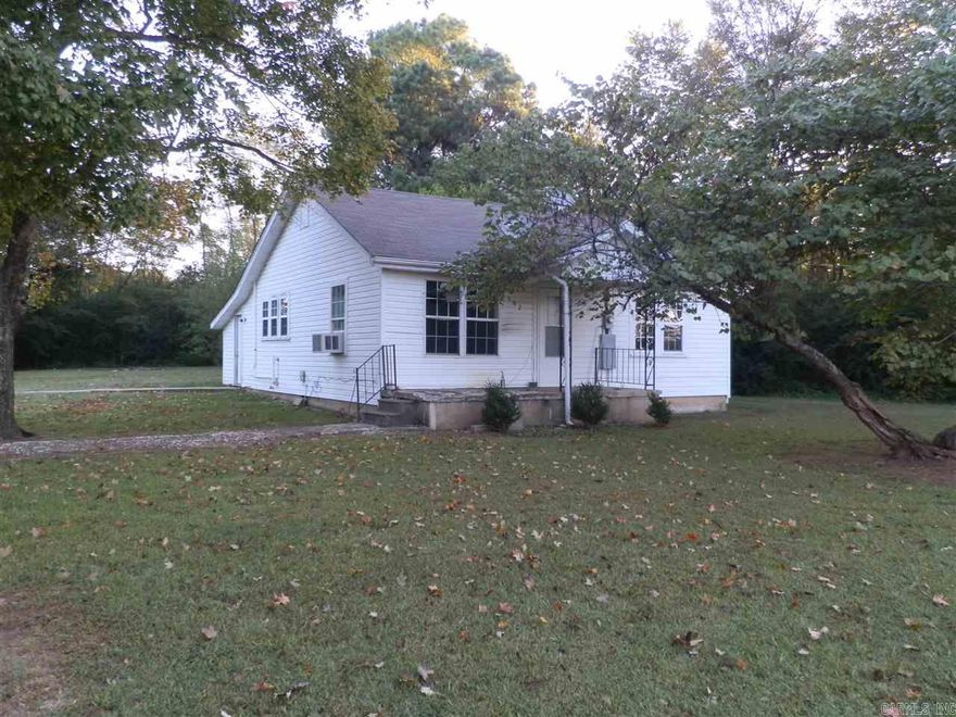 Roomy house on a large lot in the country. This house has good sized bedrooms, an eat-in kitchen and extra room with washer/dryer hookups. Two window units provide heat and air conditioning. Fridge and self cleaning electric stove furnished. Rent includes lawn care. Tenant responsible for paying all utilities. No pets. Interested persons must apply and pay non-refundable application fee for tenant screening at listing office.