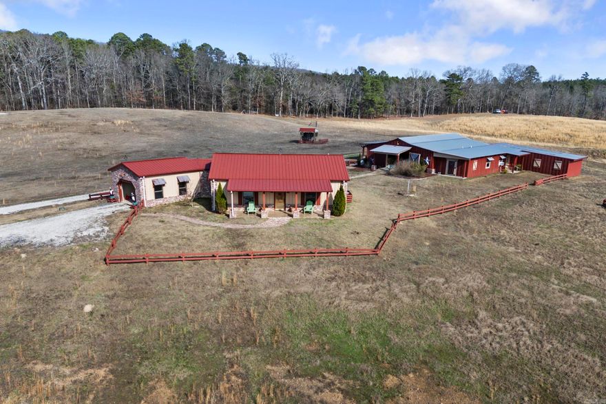 Welcome to your private ranch retreat escape on 11.34 acres of rolling, fully fenced pasture, complete with pole sheds for shelter and a gated entrance. This picturesque property offers privacy and convenience, located 25 minutes from Oaklawn in Hot Springs, within 329 miles of Weatherford, TX, and bordering Ross Foundation. Thoughtful design shines throughout the one-bedroom main home, featuring a spacious bedroom with a separate claw-foot cast iron tub and shower, and an open living, kitchen, and dining area that flows into an outdoor kitchen ideal for entertaining. The property also includes a 2,500 sq ft barn with four bay doors, a one-bedroom apartment with full kitchen and bath, ranch hand quarters with a bedroom and bath, two horse stalls (with potential for more), a shop, tack/feed room, and extra parking. Enjoy peaceful views of the rolling pasture and two stocked ponds, one equipped with a water well for pumping. The property is being sold “as is.” With the exception of the seller’s personal belongings, furnishings convey with the property. This property has SO MUCH potential and needs someone who, in the words of Gustus from Lonesome Dove, has VISION.