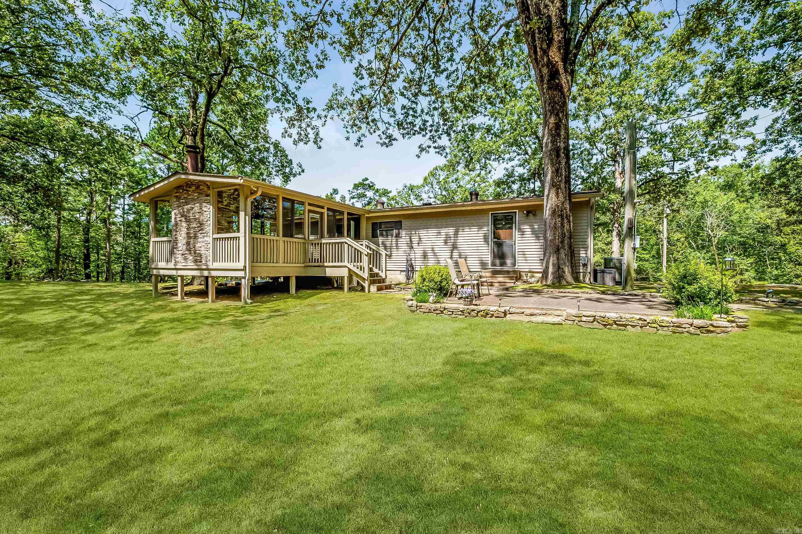 Private 1.9-Acre Retreat Off Colonel Glenn! Enjoy peace, privacy, and space on this beautiful 1.9-acre property tucked away off Colonel Glenn. The land is a rare findāgently rolling, tree-lined, and ready for your quiet country lifestyle, while still just minutes from city conveniences. This well-maintained manufactured home on a permanent foundation features a thoughtfully updated master suite (2017) with granite countertops, tile floors, and a tiled walk-in shower. A sunroom addition (2015) brings even more charm, with ceramic tile flooring, vaulted ceilings, ceiling fans, surround sound, and a cozy wood-burning fireplaceāperfect for year-round enjoyment. Additional highlights: Roof replaced in 2016 Appliances under 3 years old Security system + Control4 smart home system convey Two outbuildings, one with electricityāideal for workshop or storage This is the perfect setup for someone looking for space, comfort, and privacy in a serene setting. Come take a lookāyouāll fall in love!