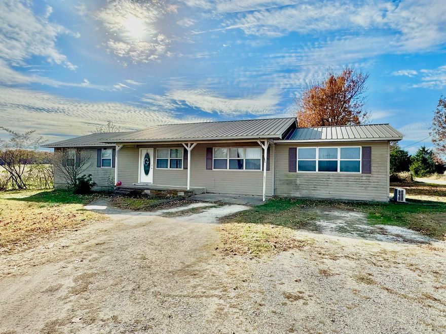 Escape the hustle and bustle while staying close to everything in this charming 4-bedroom, 2-bath home just minutes from town. Nestled in a peaceful setting, this property offers the perfect balance of privacy and convenience—enjoy quiet country living with quick access to the local school, stores, and area amenities. The home features a spacious, functional layout with comfortable living areas, and plenty of natural light. Outside, you’ll find room to relax or entertain, surrounded by serene views and open space. Whether you’re raising a family or looking to slow down in a tranquil location, this home offers the ideal blend of comfort and convenience. Don’t miss the opportunity to make this peaceful place your own—schedule your showing today!