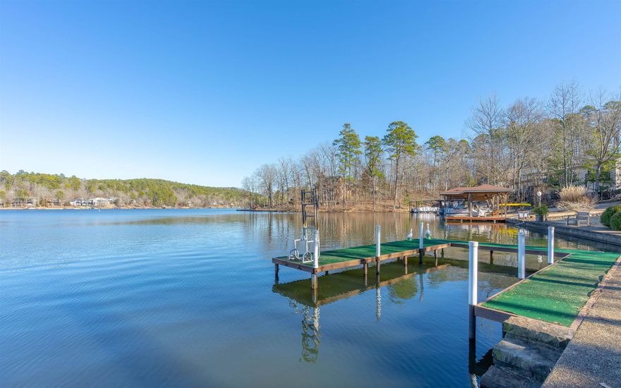 LAKE CORTEZ SHORELINE LIVING WITH A PICTURE-PERFECT VIEW OF THE WATER FROM ALMOST EVERY ROOM! Beautifully updated home of quality-sound construction that was built by an engineer for his own retirement. Stunning views greet you the moment you open the door! The expansive living area is bathed in sunlight. The first thing you will want to do is cozy up to one of two fireplaces or enjoy the deck's solitude and panoramic view for morning coffee and evening sunsets. The spacious open areas allow you to flow from one area to the next and make entertaining in this home a breeze both inside & outside!  Upstairs & Downstairs living provide privacy. Upstairs has not one but two relaxing primary ensuites featuring spa-inspired bathrooms. The office with lake view makes work & study time more enjoyable or could be fourth bedroom or exercise area. The downstairs snack kitchen & fireplace create a perfect living space for enjoying family time. There is also a workshop/hobby room for tinkering.Pleasing lake life with approximately 80' of sea wall, a boat slip, & stairs to lake provides easy access for boating, swimming, fishing, or kayaking. 1 year warranty included!  AGENTS SEE REMARKS