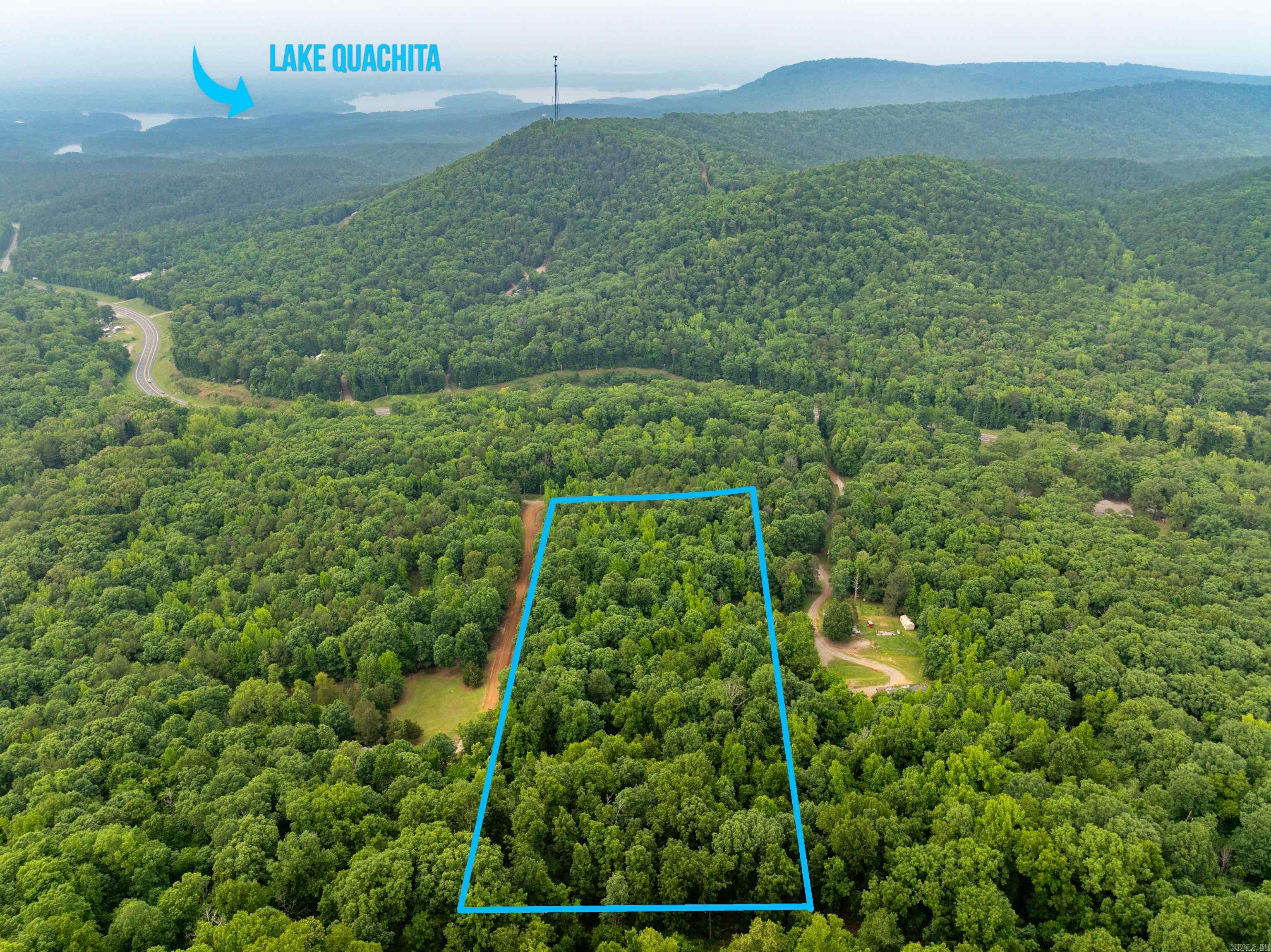 ENDLESS POTENTIAL AND BEAUTY! 8.52 wooded acres with direct access off Hwy 270 Wājust minutes from Mountain Harbor Resort (4 miles) and the pristine waters of Lake Ouachita! This scenic property features a seasonal creek, rolling terrain, a beautiful mix of mature trees, and is bordered by hundreds of acres of National Forest land. Whether you're planning a vacation cabin, boat storage, or a private retreat, this location offers exceptional potential. With utilities nearby and easy road access, development is straightforward. Enjoy the peace of nature while being close to world-class boating, fishing, and outdoor recreation. SELLER IS WILLING TO SUB-DIVIDING INTO 3-ACRE PARCELS!