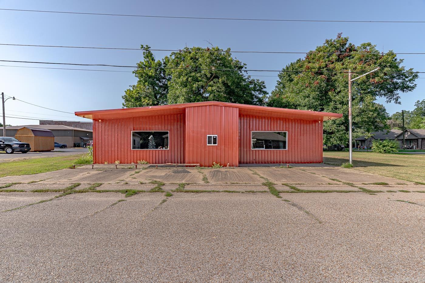 Welcome to Market 108 Walnut, a spacious 3,060 sq ft property with endless opportunities. Situated on approximately half an acre, this versatile building has a colorful history; formerly a parts store, a dance hall, and even home to a wrestling ring! Currently used by the owner for storage, the space is wide open and ready for your creative vision. Whether you're dreaming of a restaurant, retail space, event venue, workshop, or something entirely unique, the flexible layout and generous square footage make it all possible. There's even a grassy lot included that can be used for extra parking or additional development if needed. Call today to own your next investment property in the Heart of Manila, Arkansas!