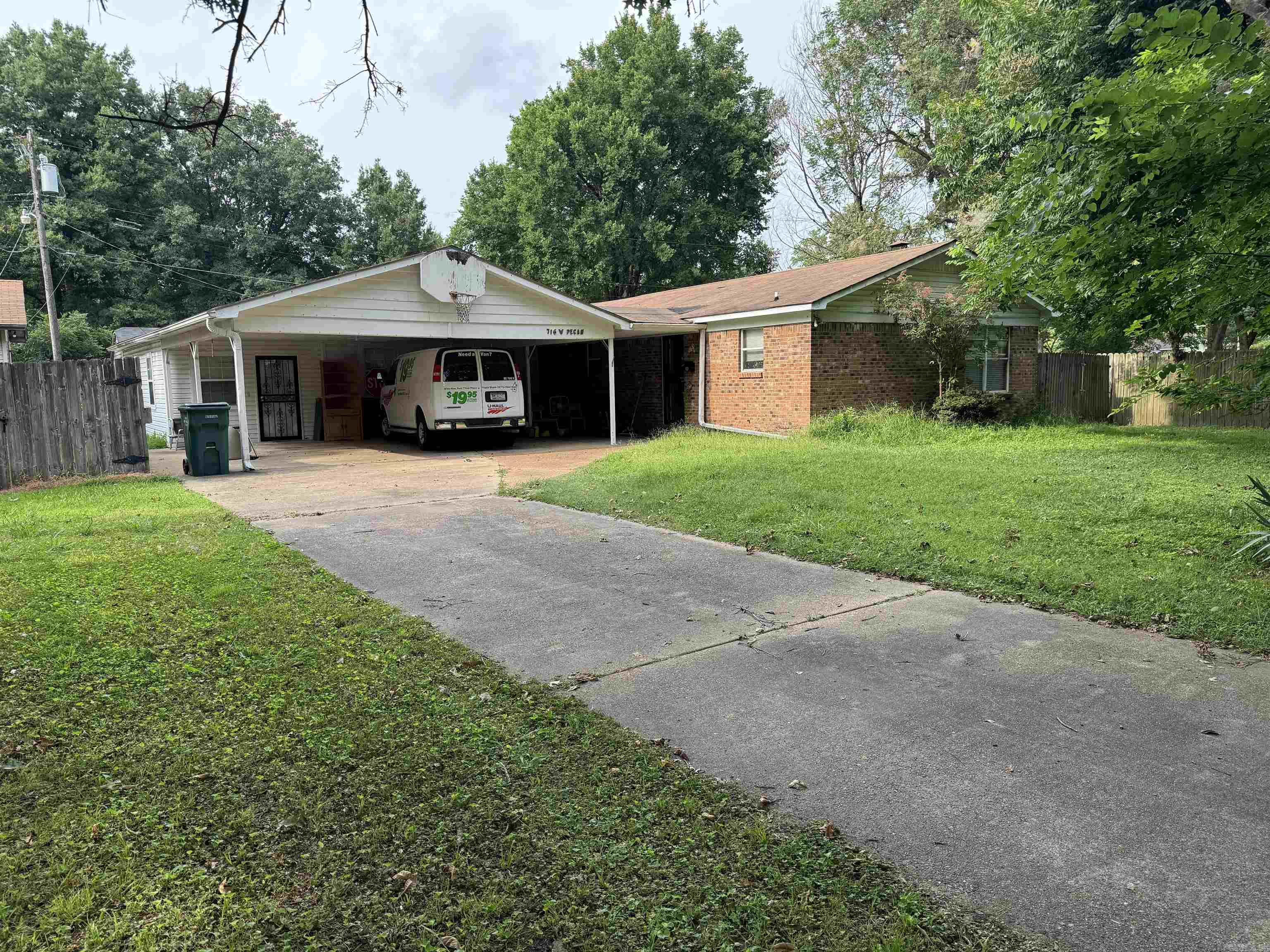 Comfortable three bedroom two bath home situated on a shady lot in Blytheville. . This home is located very near schools, shopping, and hospital facilities. With approximately 2300 square feet of living space, there's extra room for a growing family. The kitchen/dining room is large enough to accommodate a large family gathering. The living room is also a good size and has a gas fireplace for those extra chilly mornings. The oversize laundry room also has a double sink and plenty of countertops space. At the back of the home, there is a large bonus area that could be used as a game room or as storage. There's also another living area on the west side of the home that has lots of built-in bookcases.