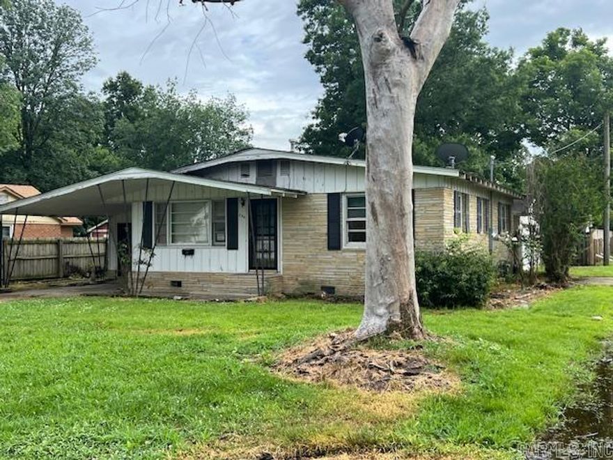 Charming esthetic on the exterior in a great location. The interior has three bedrooms one and a half bathrooms.  There is an office or bonus room near the dining room off the kitchen.  This property is in a premier location. See agent remarks.