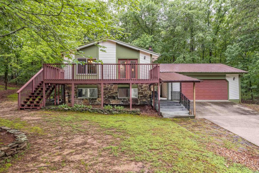 Tucked away from the main road, this charming home sits on a quiet dead-end street just a short walk from the Cool Pool! An ideal spot for ATV trail enthusiasts, with plenty of space for trucks and trailers to park. New flooring and paint throughout (2025), Metal roof (2014), HVAC (2016), New Windows (2018), Leaf Guard Gutters (2016), New garage door (2018). Fairfield Bay is a great community for fishing, boating, hiking and golfing.