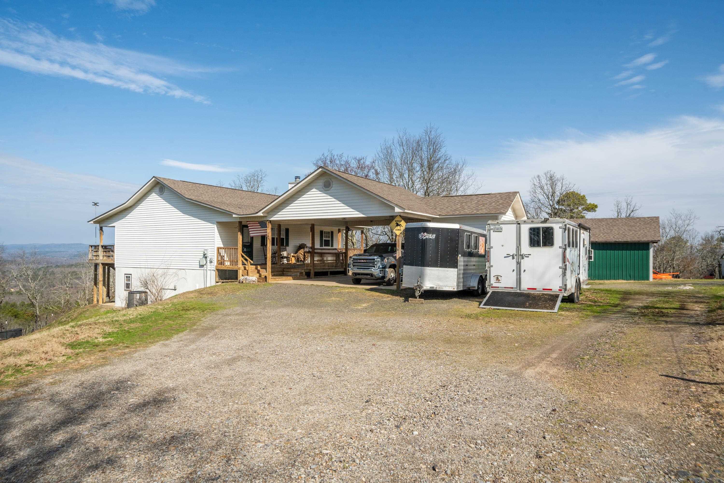 NOW is YOUR time to enjoy YOUR very own MOUNTAIN TOP HOME! ENJOY the majestic views! ENJOY the tranquility! It's time for YOU to ENJOY!! If you're looking for country living close to Hot Springs National Park and Lake Catherine State Park, this home is for you! City convenience yet located just outside the Hot Springs city limits! Located in the gated Diamondhead South area. Sprawling ranch style home with walk out basement! Very open floor plan - spacious living with a cozy fireplace, plus Master suite up. Lower level: 2 Bedrooms 1 & 1/2 bath, laundry room, and game room all with lower level outside access. Attached 2 car carport and storage building. Separate Shop approx 20x40 1/2 enclosed and 1/2 covered/open. Acres 13 (MOL) Fenced and cross-fenced with water on demand in some pastures, chicken coop. Breathtaking views, serene natural living. Don't miss this opportunity!! Open house 6/7 CANCELLED due to weather.