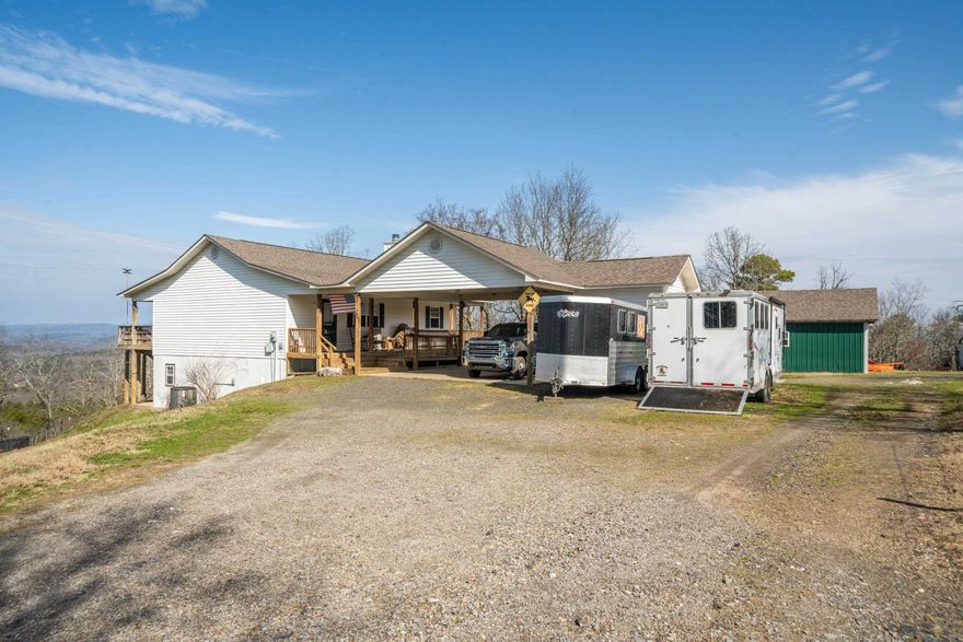 NOW is YOUR time to enjoy YOUR very own MOUNTAIN TOP HOME!  ENJOY the majestic views!  ENJOY the tranquility!  It's time for YOU to ENJOY!! If you're looking for country living close to Hot Springs National Park and Lake Catherine State Park, this home is for you!  City convenience yet located just outside the Hot Springs city limits!  Located in the gated Diamondhead South area.  Sprawling ranch style home with walk out basement!  Very open floor plan - spacious living with a cozy fireplace, plus Master suite up. Lower level: 2 Bedrooms  1 & 1/2 bath, laundry room, and game room all with lower level outside access. Attached 2 car carport and storage building. Separate Shop approx 20x40 1/2 enclosed and 1/2 covered/open. Acres 13 (MOL) Fenced and cross-fenced with water on demand in some pastures, chicken coop.  Breathtaking views, serene natural living. Don't miss this opportunity!!   Open house 6/7 CANCELLED due to weather.