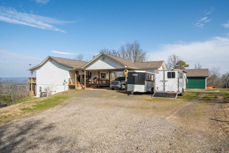 Don't miss this opportunity!! MOUNTAIN TOP HOME!  Ranch style home with walk out basement!  Spacious  living with a cozy fireplace, plus Master suite main level.Lower level: 2 Bedrooms  1 & 1/2 bath, Lower level: 2 Bedrooms  1 & 1/2 bath, laundry room, and game room all with lower level outside access. Attached 2 car carport and storage.  Separate Shop approx 20x40 1/2 enclosed and 1/2 covered/open. Acres 13 (MOL) Fenced and cross-fenced with water on demand in some pastures, chicken coop.  Breathtaking views, ENJOY the majestic views! and tranquility!  If you're looking for country living close to Hot Springs National Park and Lake Catherine State Park, this home is for you!  City convenience yet located just outside the Hot Springs city limits!  Located in the gated Diamondhead South area.  Enjoy all the amenities of Diamondhead community . Golf course, pool, tennis courts, and playground.  Call today for a showing or virtural tour!!