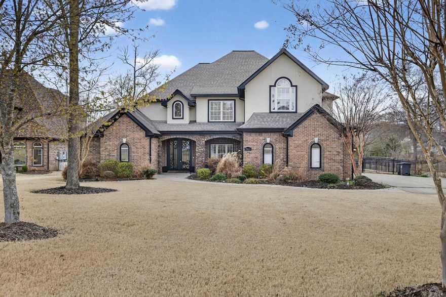 Sunsets on the lake, evenings by the fire, and a backyard built for entertaining, this Hurricane Lake Estates home has it all! This stunning 4 bedroom, 3.5 bath home sits directly on the water and offers the kind of views and lifestyle buyers dream about. From the moment you step inside, soaring ceilings, grand windows, and beautiful architectural details create an open, light-filled space designed for both comfort and entertaining. The spacious living area features dramatic ceilings, elegant staircase railing, and a wall of windows overlooking the backyard oasis and lake. The oversized primary suite feels like a private retreat with a fireplace, sitting area, and spa-like atmosphere. Thoughtfully designed living spaces throughout provide room for gatherings while maintaining warmth and charm. Step outside and you’ll quickly realize this home is truly special. The backyard is an entertainer’s dream with a sparkling pool, covered cabana area, and expansive patio perfect for relaxing or hosting. Enjoy peaceful water views, fishing, kayaking, or evening sunsets from your private boat dock.