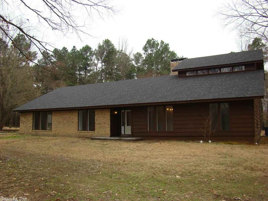Searching for a large home with acreage in Southwest Arkansas?  This 3,160 sqft updated cedar home boasts a phenomenal kitchen with convection double oven, massive master bedroom with huge shower & his-n-hers walk-in closets, library/office off master, formal dining room, upstairs bonus bedroom with balcony & full bath, all on 10+/- Acres!  You owe it to yourself to view this home in Southwest Arkansas! (Additional 22 acres that can be purchased)