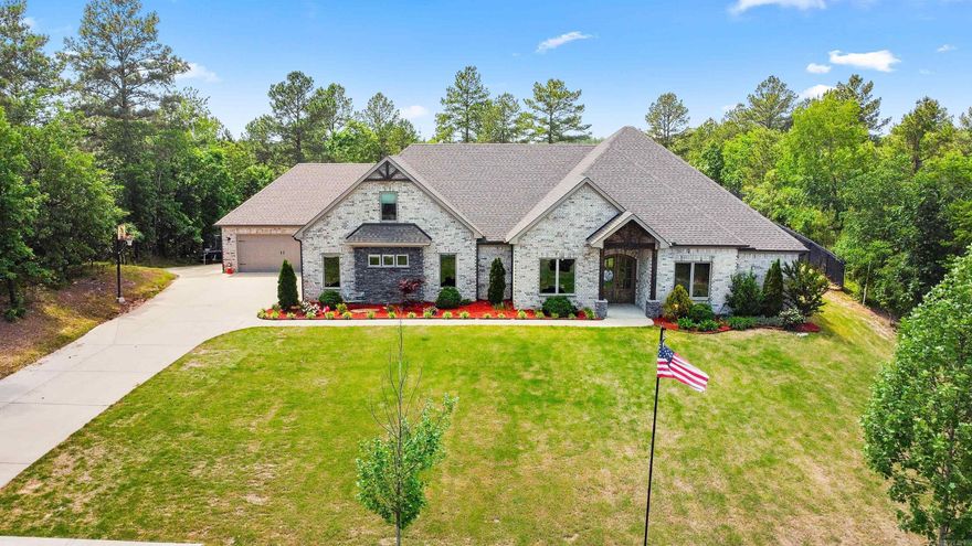 This spacious 5 bedroom estate with sports pool is perched atop a 2 acre scenic lot with constant breeze, peach trees & muscadine vine in the premier Stonehill Estates. Home offers blend of luxury, space & privacy. Built in 2020, this energy efficient smart home offers an expansive open layout flooded with natural light from large windows. Home boasts marble countertops, top of the line appliances, ice maker, center island & large pantry in kitchen, wood vaulted ceiling extended to back patio in spacious greatroom with fireplace, large bedrooms with plenty of closet space, generous bonus room with mini-fridge & entertainment bar. Luxurious primary suits has beach themed color design with spa inspired deep soaker tub & custom oversized shower. Covered back patio with fireplace overlooking the large sport saltwater pool with custom LED lighting offering the perfect balance of leisure & activity. 4 car garage set up with one drive through bay with garage doors on both sides & added electric circuits to accommodate high powered tools & machinery. Whole home is insulated with encapsulated foam, tons of storage, safe room, hidden walk in room tucked behind a concealed entry.