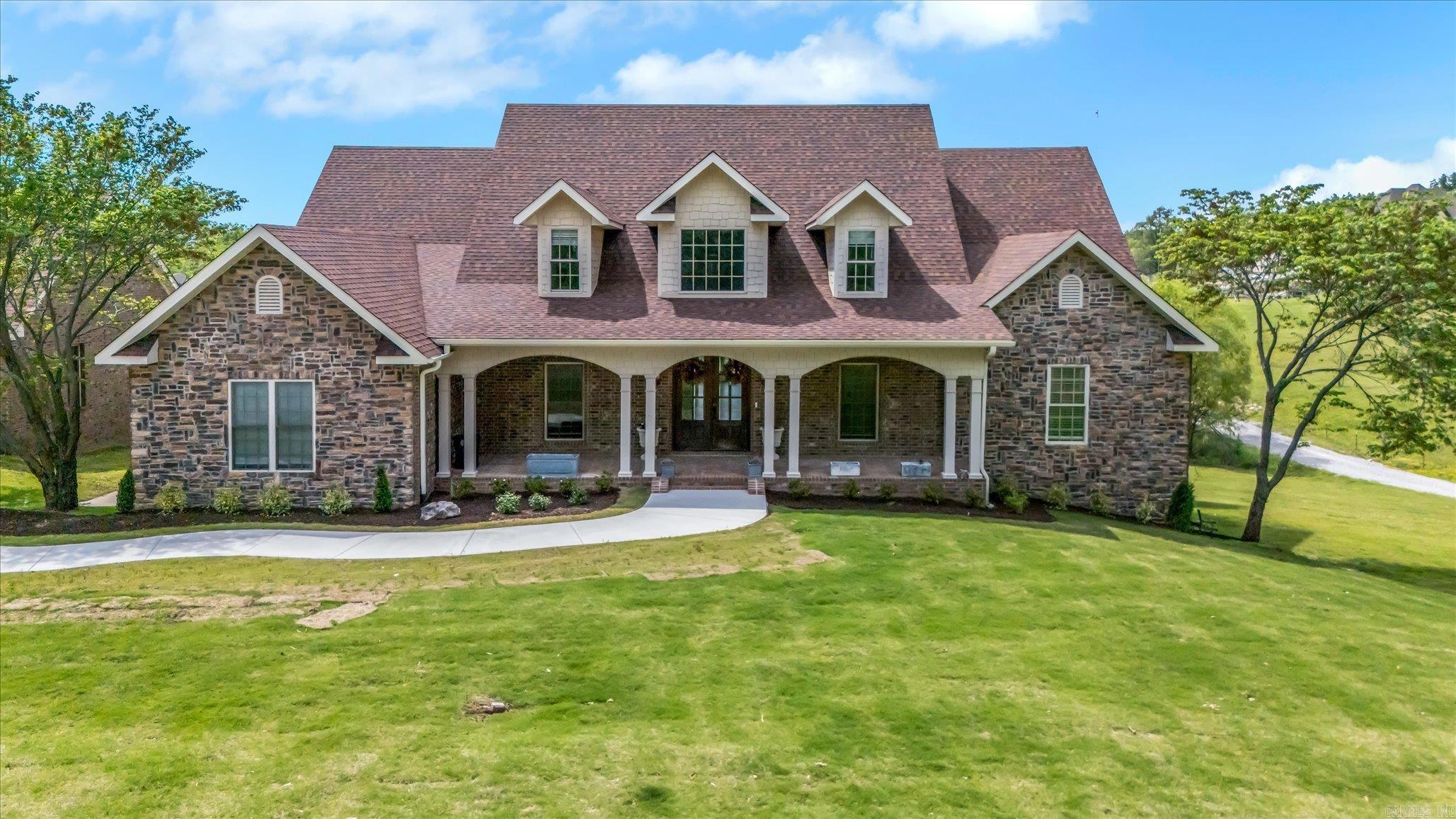 Just beyond the Jonesboro city limits, this private five-acre retreat blends thoughtful design, modern comfort, and peaceful country living. Surrounded by open fields and mature trees, the custom-built home offers four bedrooms, five full baths, two half baths, and a layout that perfectly balances elegance and functionality. The main level features hardwood floors, vaulted ceilings, custom built-ins, and a cozy gas fireplace. The kitchen is a cookās dream with an oversized island, gas range, stainless appliances, granite countertops, and direct access to the sunroom and deck overlooking a tranquil pond. The primary suite provides a relaxing escape with a soaking tub, walk-in shower, dual vanities, and ample storage. Two additional en suite bedrooms are on the main floor, plus an upstairs guest suite for added privacy. The walkout basement offers a media room, full bath, covered patio, and a dedicated safe room. A newly finished flex space off the three-car garageāwith its own entrance and overhead glass doorāadds endless possibilities for a gym, studio, or guest quarters. Rarely does a property combine craftsmanship, acreage, and convenience like this one.
