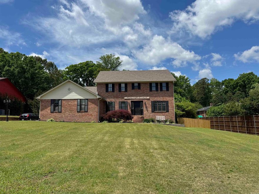 This all brick home offers over 3,400 square feet of comfortable living space with room for everyone! Featuring 5 bedrooms and 2.5 bathrooms, this thoughtfully designed home combines generous living areas with a functional layout perfect for everyday living and entertaining. The main level features an inviting open floor plan with a huge formal dining room, a breakfast room, and additional space for a kitchen table, giving you multiple options for hosting family gatherings and special occasions. The large den is the heart of the home, complete with a cozy wood-burning fireplace. The rustic sunroom or second living area adds even more flexible space for a sitting room, playroom, office, or media room. Conveniently located on the first floor, the guest bedroom provides privacy and flexibility for visitors or a home office setup. Upstairs, you’ll find four additional oversized bedrooms and two full bathrooms, offering plenty of space for family and guests. The enormous primary suite is a true retreat with room for all your large furniture. The basement has a kitchenette layout with a sink which will make entertaining or doing hobbies a snap.  Don't miss the back yard, it is amazing.