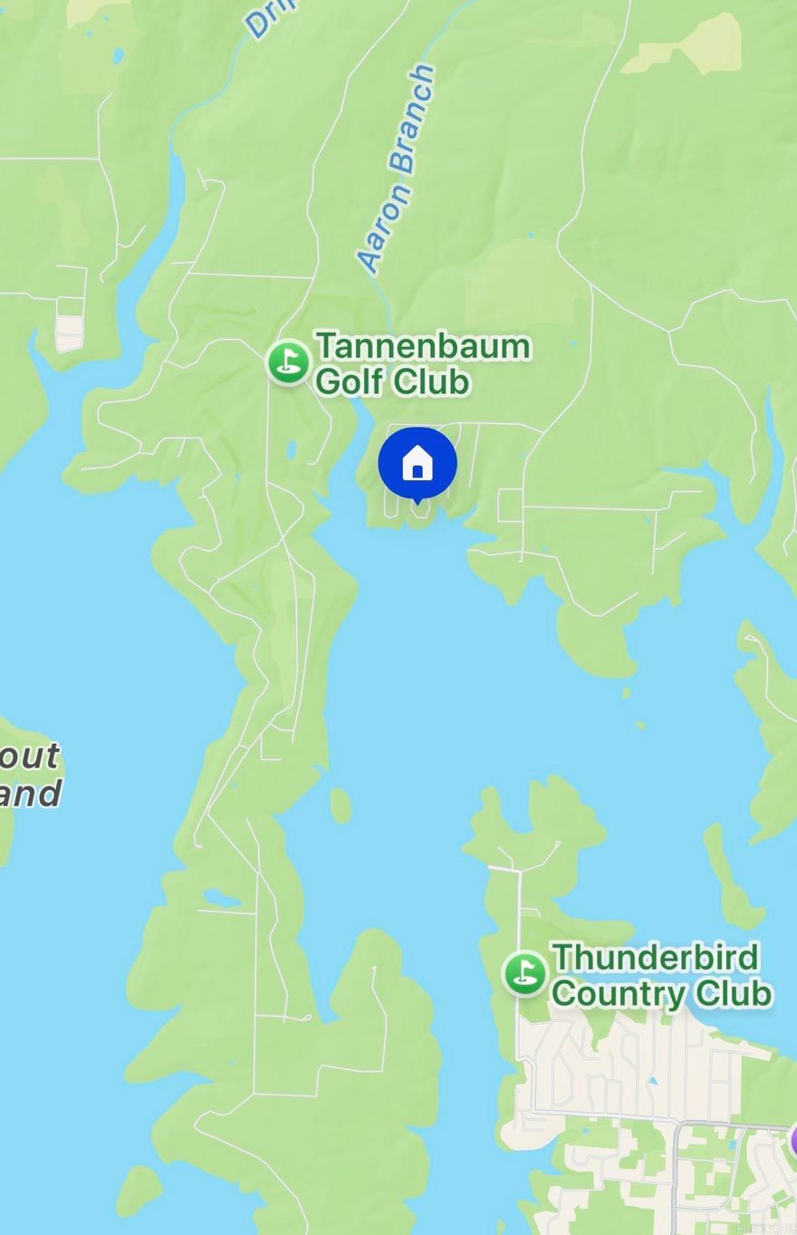 2 Lots for the price of 1!  Arkansas fieldstone lake house - perfect for weekend getaways. Four bedrooms down with a spiral staircase to a large sleeping loft. Great room with stone fireplace converted to propane that could easily be converted back to wood burning. Open kitchen area, two full bathrooms, fully screened back porch and covered front porch. This house sits on Lot 25. The adjacent Lot 23 has the shop of your dreams! Huge 30x50 building has three oversized bays with tall garage doors to accommodate even the tallest pontoon boat and extra room for all of your other toys. There is a large workbench area ready for the handyman/handywoman. It also boasts a 14x50 covered area in back, perfect for storage or BBQ's. ALL FURNISHINGS STAY and you can be on the lake in minutes!