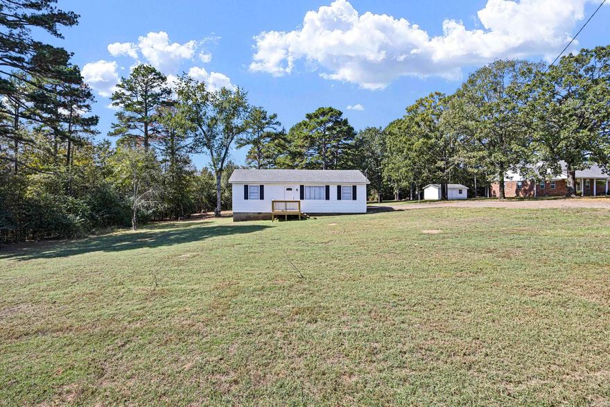 Welcome to this adorable 3-bed, 1-bath home, tucked away for peaceful living while still being minutes from the main road for easy access. This home has been completely renovated from top to bottom, offering the perfect blend of modern updates and cozy country charm. Step inside to find brand-new flooring throughout, including plush carpet and luxury vinyl plank wood for a warm, inviting feel. Fresh paint and new flush ceiling lights brighten every room, creating a clean and welcoming atmosphere. The quaint kitchen is a true highlight — featuring new appliances, butcher block countertops, and charming touches that make it feel like home the moment you walk in. Enjoy a large yard surrounded by mature trees, offering privacy and plenty of space for outdoor living, gardening, or entertaining. This move-in ready home has everything you need. Don’t miss your chance to own this cozy countryside retreat!