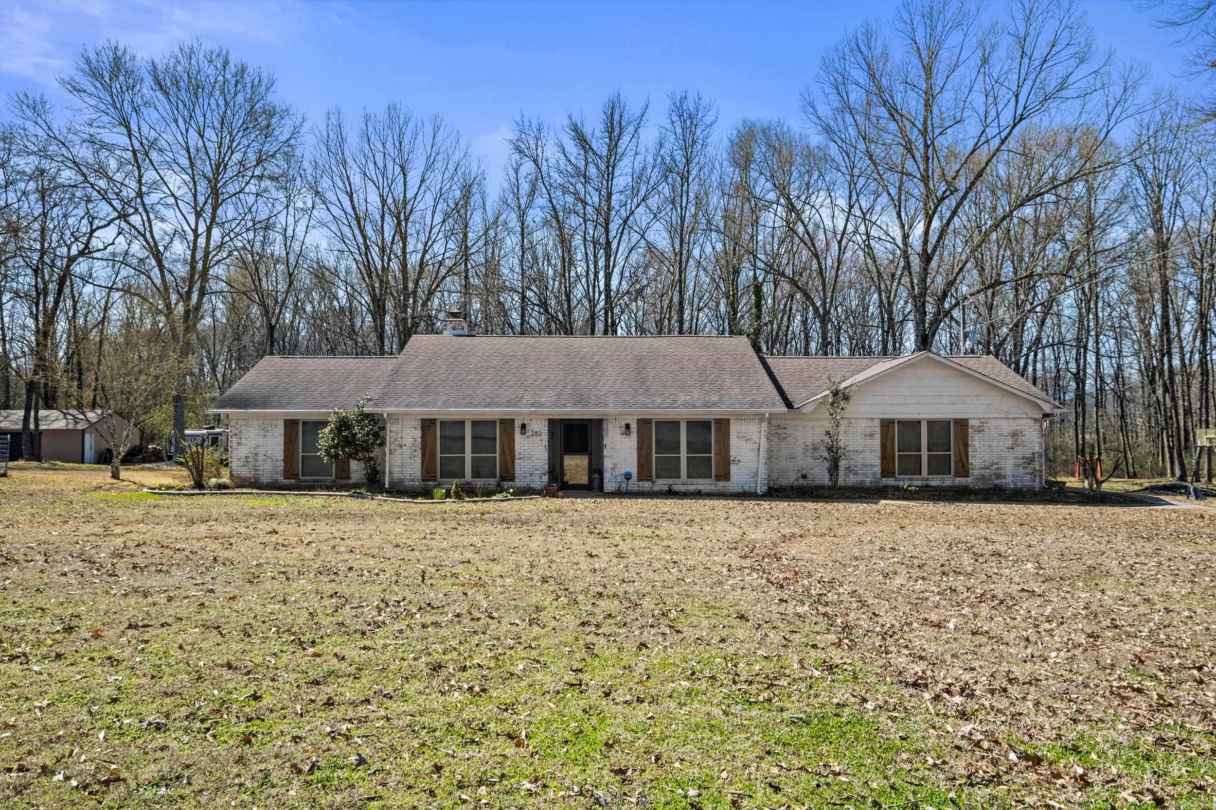 Welcome to 282 Kingwood Circle, a beautifully maintained and move-in-ready home located in a desirable neighborhood in Cabot, on 4 ACRES with 20X30 SHOP! This spacious 3 bedroom, 2 bathroom residence offers the perfect combination of modern updates and timeless charm. This open and inviting floor plan has a large vaulted ceiling living room with beam details, wood-burning fireplace that seamlessly flows into the kitchen and dining areas. The kitchen features granite counter tops, large breakfast area & Formal Dining Room making it a true chef's delight. The generous master suite offers a split en-suite bathroom, complete with His/Her Vanities & Huge Walk-in Closet. Additional bedrooms are generously sized and you will love the oversized bonus room! The Screened in Porch features Brick Flooring and Opens to Large Covered Patio! Located in the heart of Cabot, this home is close to schools, parks, shopping, and dining, providing the convenience of a central location without sacrificing privacy or tranquility. Donāt miss the opportunity to make this gorgeous property yours. Schedule your showing today!