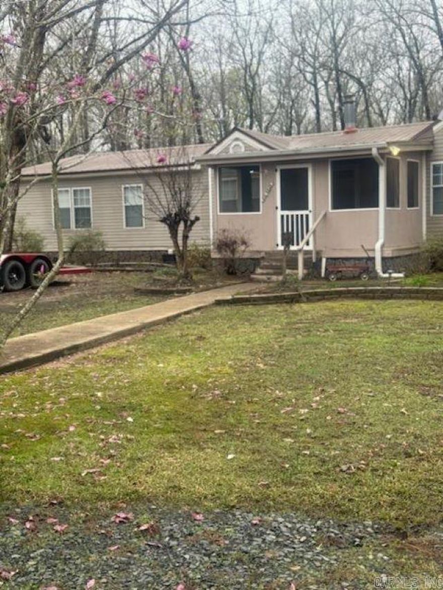 Beautiful acreage with the most immaculate double wide you have ever seen.