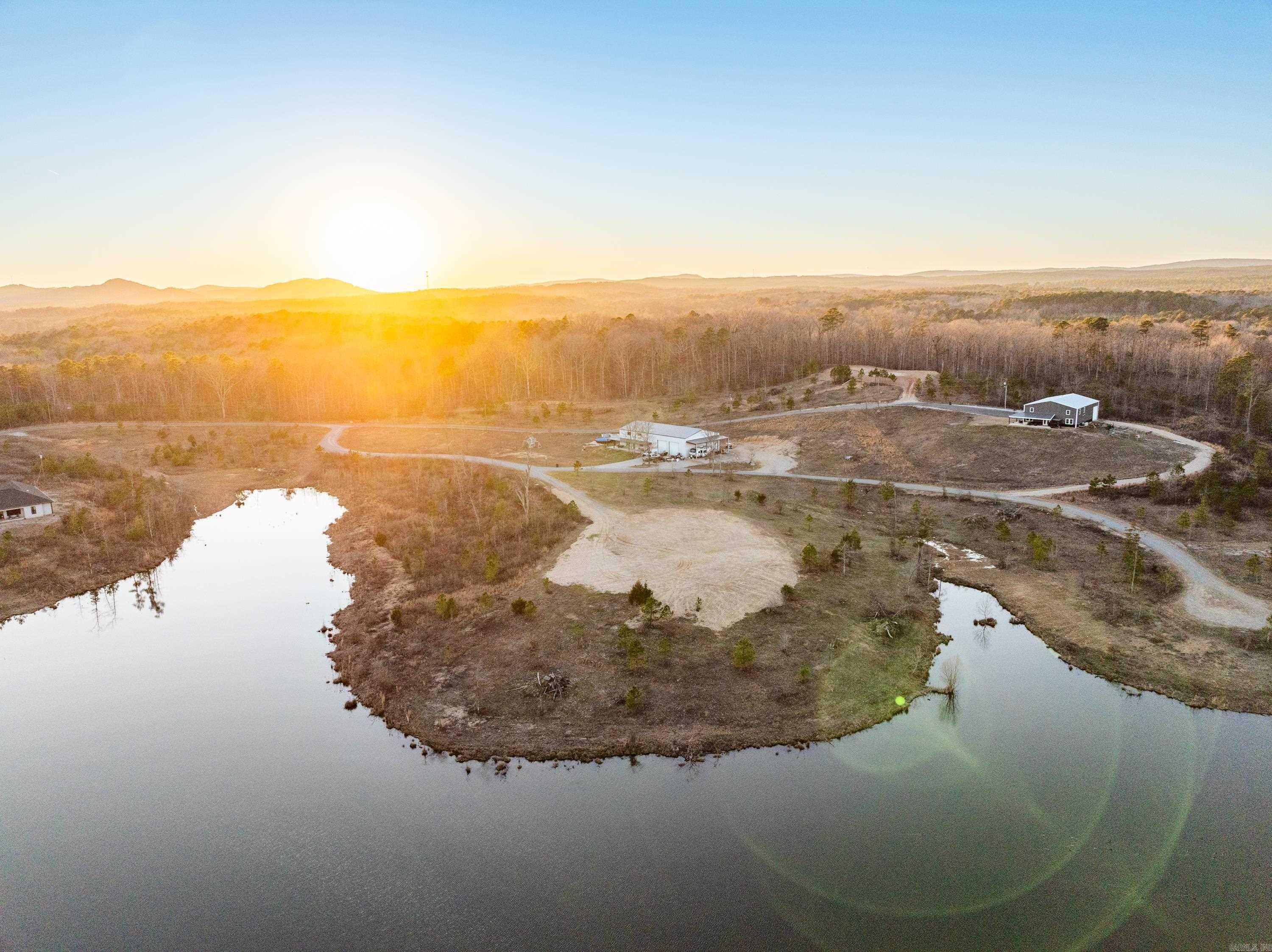 Embrace the charm of lakeside living in this hidden gem of a gated community, where tranquility meets exclusivity. This exceptional 7.12-acre lakefront lot offers a rare combination of natural beauty and usable space, with mostly level land and multiple flat building sitesāideal for building the private retreat of your dreams. Nestled along the peaceful shores of a small, pristine lake, the property provides an intimate setting perfect for those seeking a quieter, more connected lifestyle. Whether you're savoring your morning coffee with views of the water or exploring the land's generous acreage, this lot offers both serenity and potential. Enjoy direct lake access for paddleboarding, kayaking, or quiet moments by the waterās edge. The community itself is small and gated, fostering a close-knit atmosphere where neighbors become friends and nature is your everyday backdrop. This isnāt just a piece of landāitās an opportunity to build a home that reflects your lifestyle in a place where privacy, peace, and natural beauty abound. Minimum 1800 sqft home required.