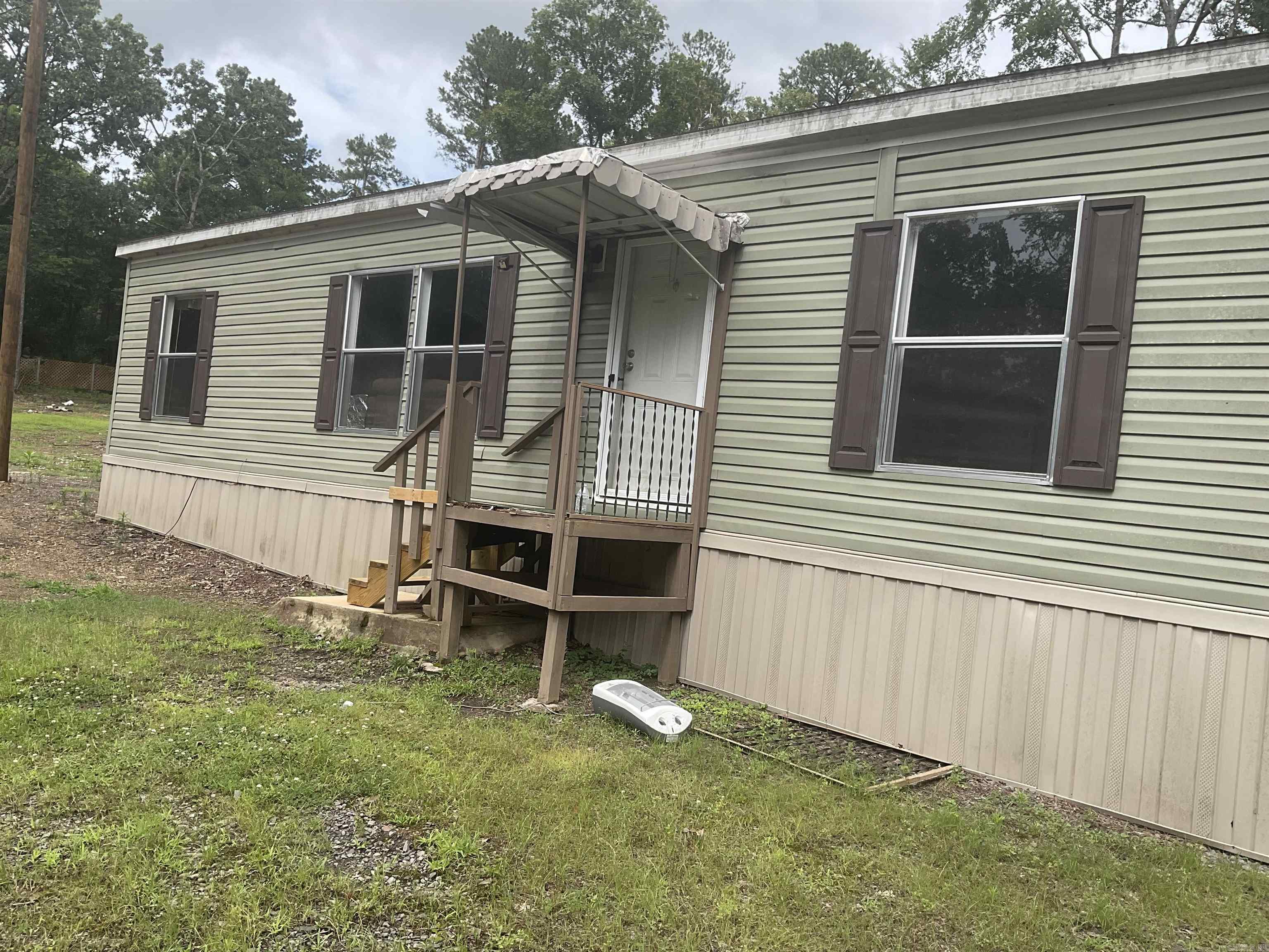 PEACEFUL COUNTRY LIVING-MODULAR HOME ON 2 SECLUDED ACRES Escape to the quiet of the countryside with this 3 bedroom 2 bath modular home that sits on 2 private acres. Enjoy the seclusion and space and a whole home generator, which offers peace of mind ensuring comfort no matter the weather.