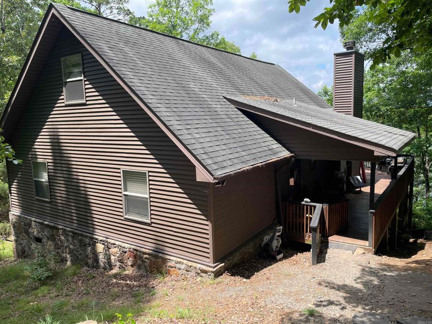 Talk about getting away!  This 3 bedroom (1 is the loft) and 2 bath home is nestled next to Greers Ferry Lake in Shirley.  Great view of the lake (all season), enjoy this home as a weekend spot, vacation home, or permanent residence.  Community boat launch minutes from the property to enjoy the beautiful lake. 20 mins from Fairfield Bay, 15 mins from Clinton.  Some items will convey see Agent remarks.