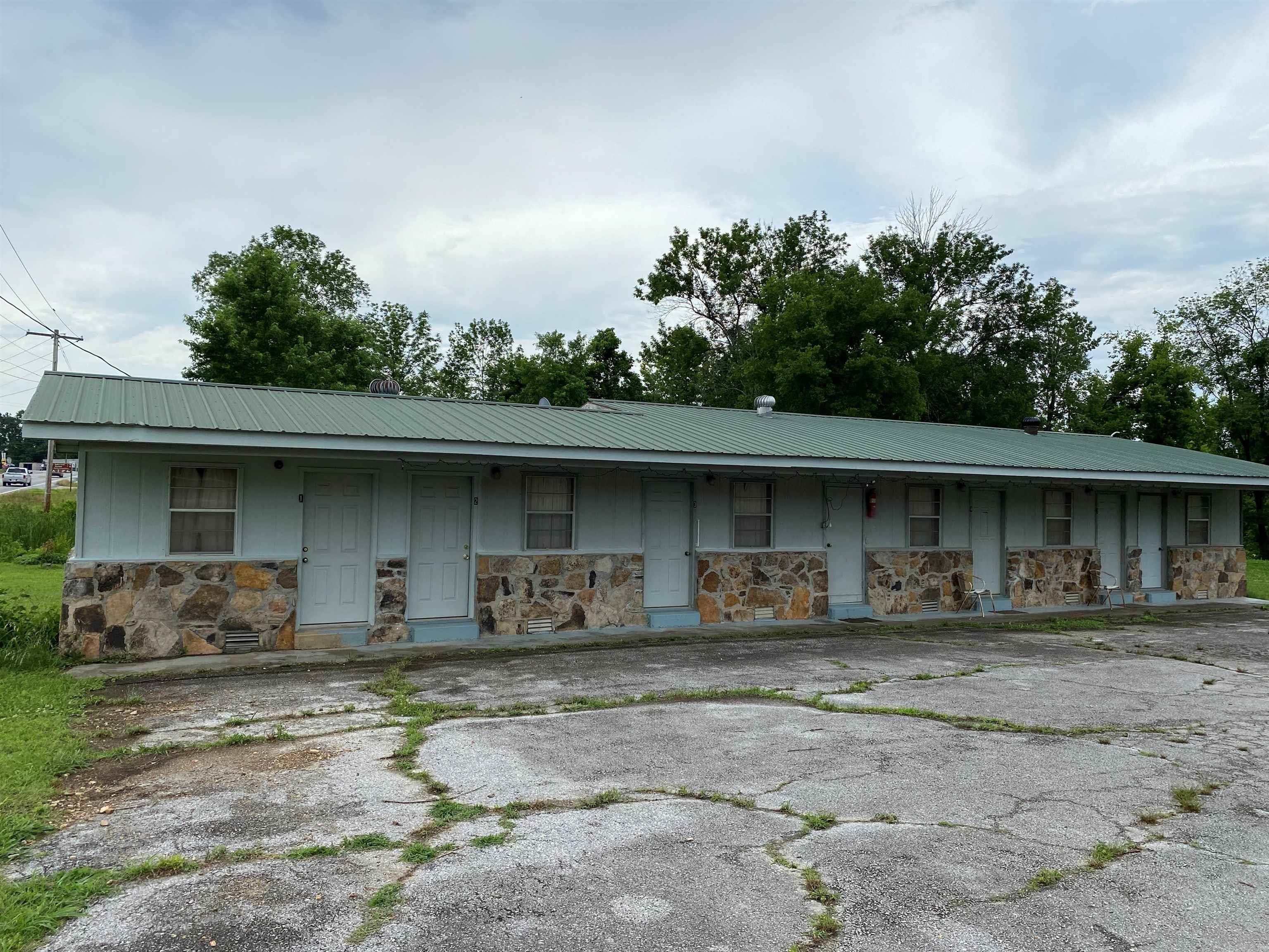 Home and income possibilities come with this house and 5-unit motel with opportunities for a beauty salon, office, etc. Total Square footage for Home/Salon/Motel is 3113 Sq. Ft. Two bedroom home could be converted to three bedrooms. Small shed for a workshop, storage, etc. Pretty park-like yard with room for your toys. Great location in small town on US Hwy 65 in the heart of the Buffalo National River country. Within 15-30 minutes of multiple landings on the river. Within an hour and 10 minutes of Bull Shoals, Table Rock, Taneycomo, Norfork and Greers Ferry Lakes, and the White and Little Red Rivers. Located within minutes of numerous camping, hiking, canoeing, hunting and sightseeing venues. Come check out this property offering a home and income stream opportunities! All #'s approximate. Acreage and age are estimates.
