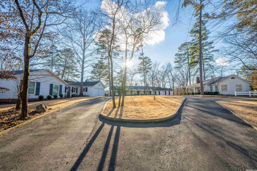 This family retreat is one of a kind. Three homes on Lake Hamilton! They are all professionally decorated and landscaped. The main house is 2 BR, 3 full baths, a pro kitchen, and a whole house generator. One of the guest cottages has 2 BR and 2 full baths, fireplace, and a full kitchen. The third cottage has 4 BR and 3 full baths. It also features 2 Large gathering areas. Outside you will love the ipe wood decks and the flagstone patios. There is a built in hot tub, firepit, and a boat dock with a lift.