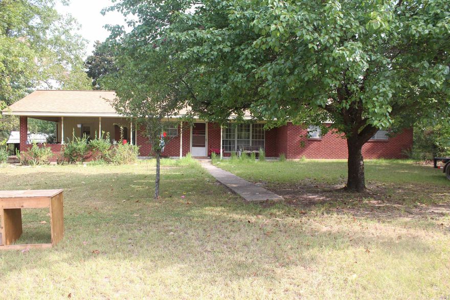 Two-bedroom 2 bath all face brick home for sale. Just outside the city limits of Hope, AR., plenty of room for all toys and pets. Has 2 fully stocked ponds or do you prefer ATV riding, horseback riding or Deer hunting. Home has a front porch for sitting that is 78 sf. There are several storage buildings on the property also. Additional square footage can be attained by enclosing the carport. That would allow for a 460 sf (20x20) bedroom.
