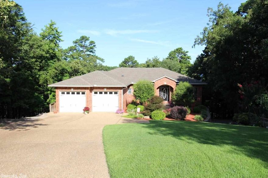 The finest of living and on the Ponce de Leon de Leon Golf Course. Screened Porch has been transformed into a sunroom.  Lower level is a second living area complete with kitchenette, living area and additional bed and bath. Granite countertops, gas logs & built-ins by FP-  this home has it all. Tile, hardwoods & carpet on the inside and the exterior consists of both brick and vinyl. 1030 SF is outside accessed lower level. East end and just off the main strip.  TV above FP conveys & ask about the golf cart!