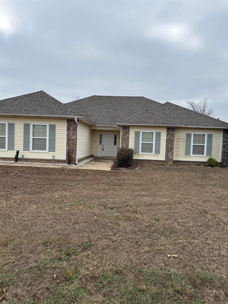 This home sits on just over an acre in the Bauxite School District and offers 3 bedrooms, 2 full bathrooms, and just over 1,700 sq. ft. of living space.  Pets are allowed with some restrictions, and the back patio is set up for pets. A refrigerator is provided, along with access to a freezer in the garage.  Additional features include a two-car garage with a storm shelter, washer and dryer hookups, and ample outdoor space for privacy and enjoyment.