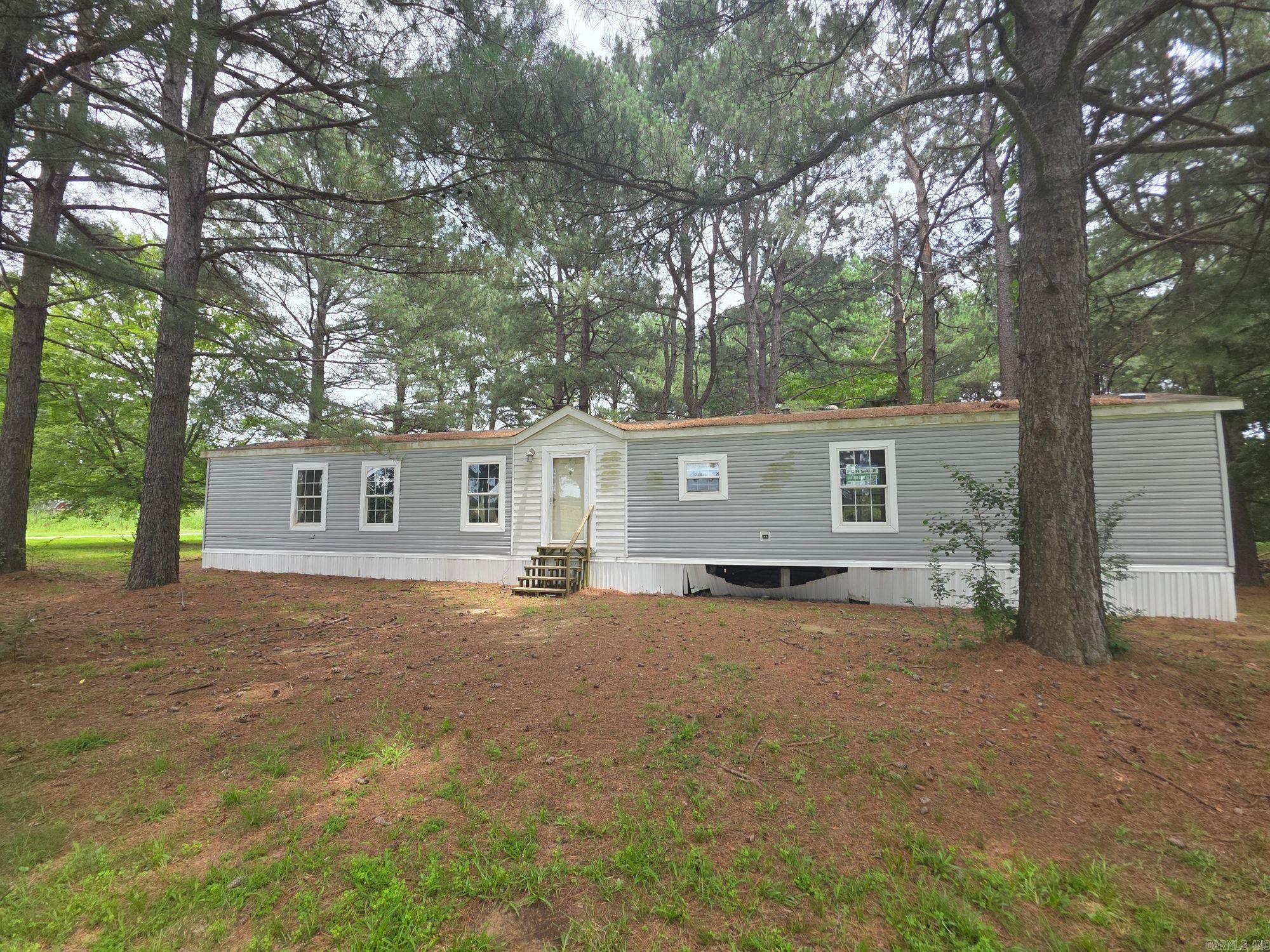 Well-maintained 3 bedroom, 2 bath manufactured home on 3.65 acres. Built in 2010, this 1,216 sq. ft. home offers an open floor plan with spacious living areas and split bedrooms. Property provides plenty of outdoor space for privacy, gardening, or recreation. Convenient location with land and home package included.
