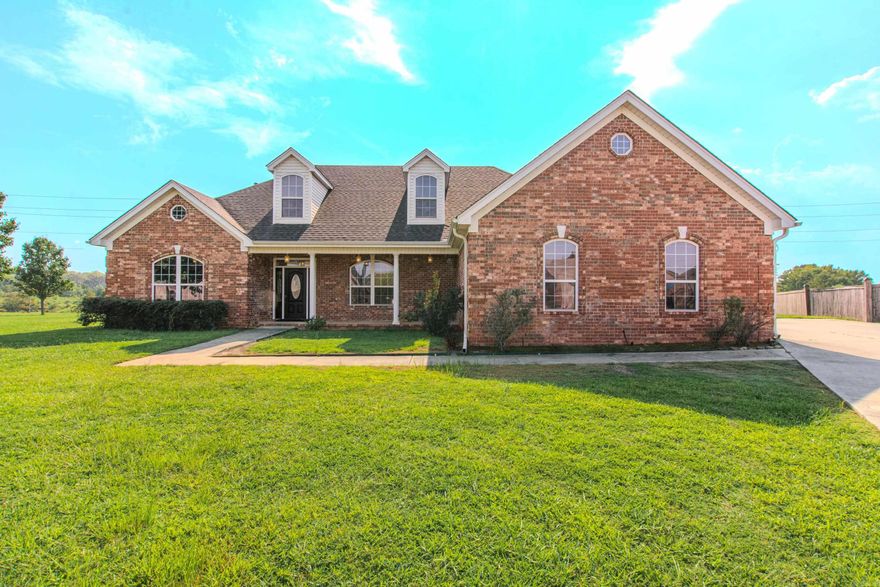 Welcome to this wonderful, multigenerational home with three car garage, on the lake! Two homes in one and handicap accessible, has so much to offer! Main floor has three bedrooms, two baths, two living areas, both with fireplaces, formal dining room, chefs kitchen with huge island, gas range, refrigerator, lots of custom wood cabinets, desk area, two microwaves and walk-in pantry! Also has heated/cooled sunroom with great view of the lake, so peaceful! The second floor has full kitchen, dining/living area, bathroom, bedroom and a huge bonus room and the best part, a private entrance! Two tankless water heaters, newer roof and generator! Some photos are virtually staged.