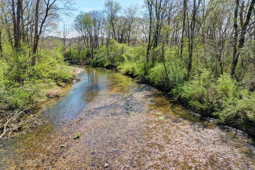 Great development opportunity in the heart of Hot Springs, where potential meets prime location. This remarkable property presents an impressive 1,800 feet of Saline River frontage paired with 1,500 feet of valuable highway frontage, creating unlimited possibilities for visionary developers and investors. The property's expansive level acreage offers an ideal canvas for your development dreams, whether commercial, residential, or mixed-use projects. Strategic positioning just half a mile from the new bypass ensures excellent accessibility and visibility, while maintaining a connection to nature with its scenic river views. The property's extensive frontage along both the Saline River and highway provides flexibility for various development concepts while ensuring maximum exposure and accessibility. Don't miss this chance to secure a piece of Hot Springs future growth corridor. With its perfect blend of natural amenities and strategic positioning, this property stands ready to transform into your next successful development project.