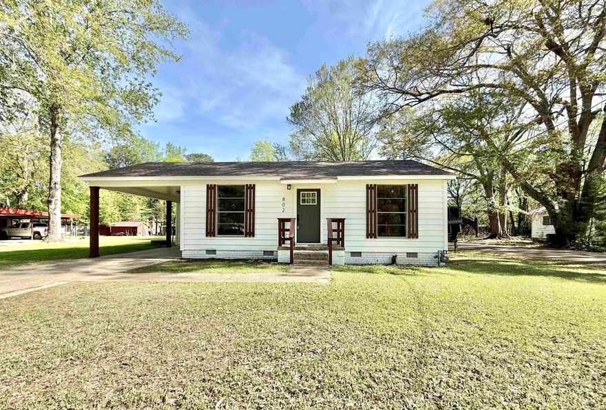 Do not walk, Run! To this updated 1200 sq ft 2 bed 2 bath home, (3rd bedroom, office, or second living area possibility) located on a spacious corner lot with attached parking and storage area. Updated kitchen with new cabinetry, granite countertops, & stainless appliances. This home boast new vinyl plank flooring, fresh paint, lighting, new bathroom vanities, tiled bathtub surround, walk-in shower in the master bathroom. New roof and a home warranty provided with acceptable offer.   Square footage, lot dimensions, and taxes taken from courthouse records. Seller never lived in home no property disclosure provided.