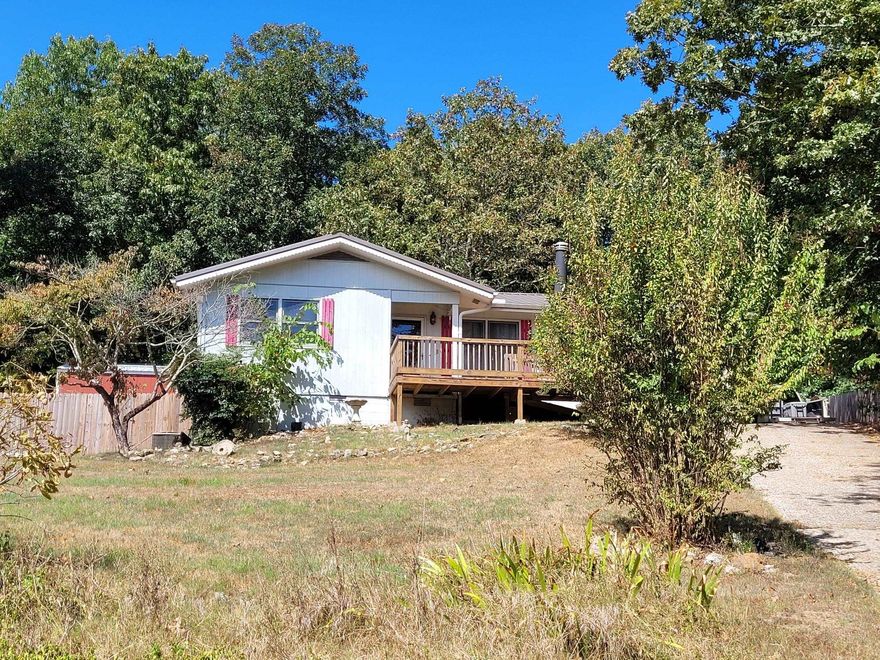 Step right into this charming and updated 2-bedroom home, which offers the potential for a third bedroom and boasts 1.5 bathrooms across a comfortable 1,100 square feet. The main living areas feature attractive laminate flooring, and the eat-in kitchen comes fully equipped with all appliances, including the washer and dryer. Enjoy peace of mind with many recent updates, including the HVAC system, roof, and updated front and back porches. For added comfort and utility, the home includes a propane stove for backup heat, ample storage throughout, and a fantastic large, carpeted, screened porch. There is a chain-link fenced backyard and a big shed. A walk-out, unfinished basement area provides additional storage. Located in the amenity-rich community of Cherokee Village, you'll have access to multiple lakes and golf courses, and you're just a short drive from the beautiful Spring River, historic downtown Hardy, and Mammoth Spring State Park.