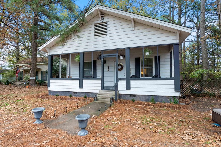 A true rare find! This cozy home provides modern conveniences without sacrificing character and uniqueness that accompany an established home. This thoughtfully modernized 1944 build has it all! Boasting its original hardwood floors, high ceilings, an elegant claw foot tub, generously sized rooms, and a sprawling front porch this home is perfect for those seeking a rural feel and proximity to amenities. Renovations to the home enhance/preserve its original charm and include freshly painted walls and granite kitchen counters, and a jetted tub in the master bathroom among others. The primary bedroom is complete with a walk-in closet and a private entrance to the back deck. Storage is an added luxury with this home featuring a laundry room, generously sized pantry, built-ins in both bathrooms, and even a broom closet. The yard is generously sized and is fenced in. This property sits nestled in an established neighborhood lined with mature trees. This rare combination of a classic feel and modernized updates on a generously sized lot is a unique find at under 200k. This home is zoned for highly coveted Bryant School District but still within 30 minute commute to Little Rock! Come see!